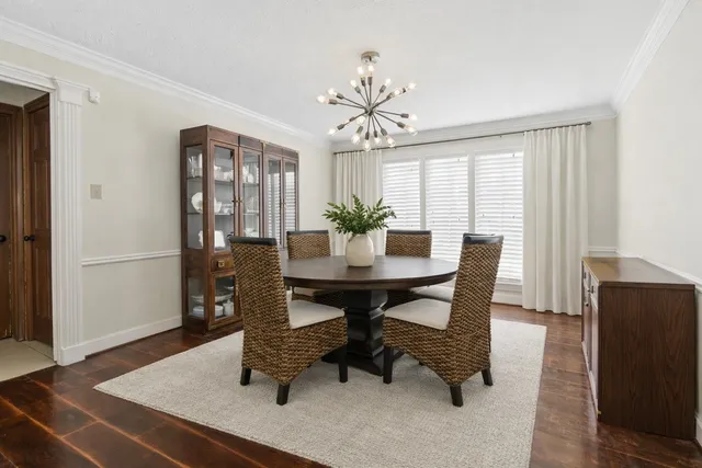 a view of a dining room with furniture and window
