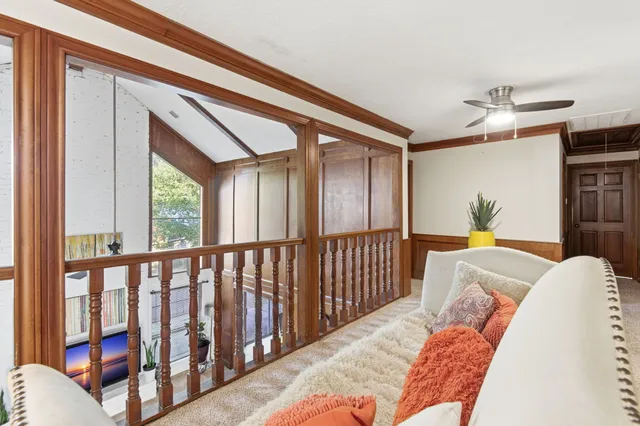 a bedroom with furniture and a window