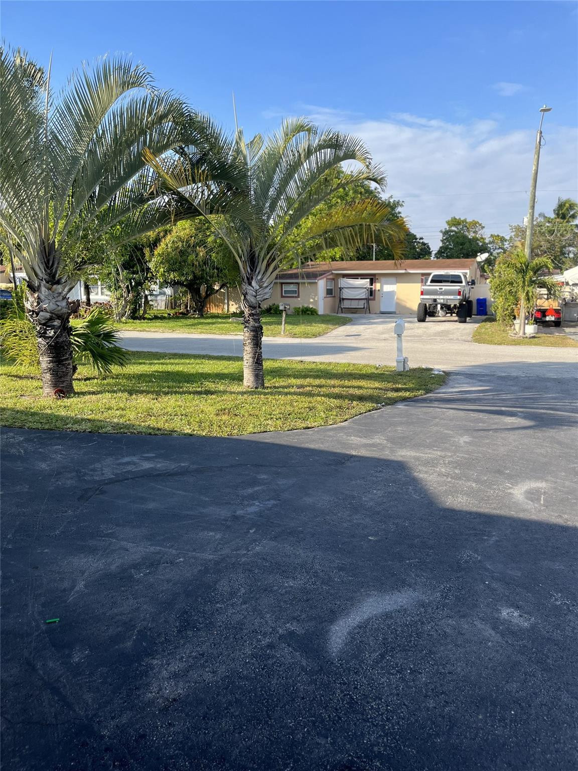 280 Northeast 23rd Street Pompano Beach, FL 33060 - Photo 2 of 12 a view of a fountain in front of a house