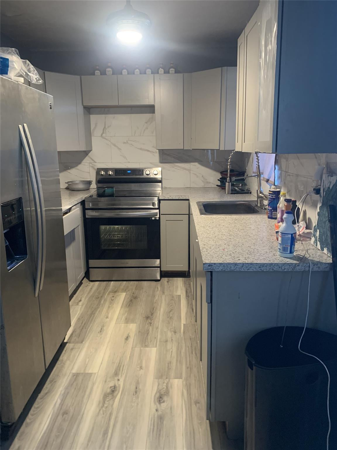 280 Northeast 23rd Street Pompano Beach, FL 33060 - Photo 4 of 12 a kitchen with granite countertop a refrigerator stove and sink