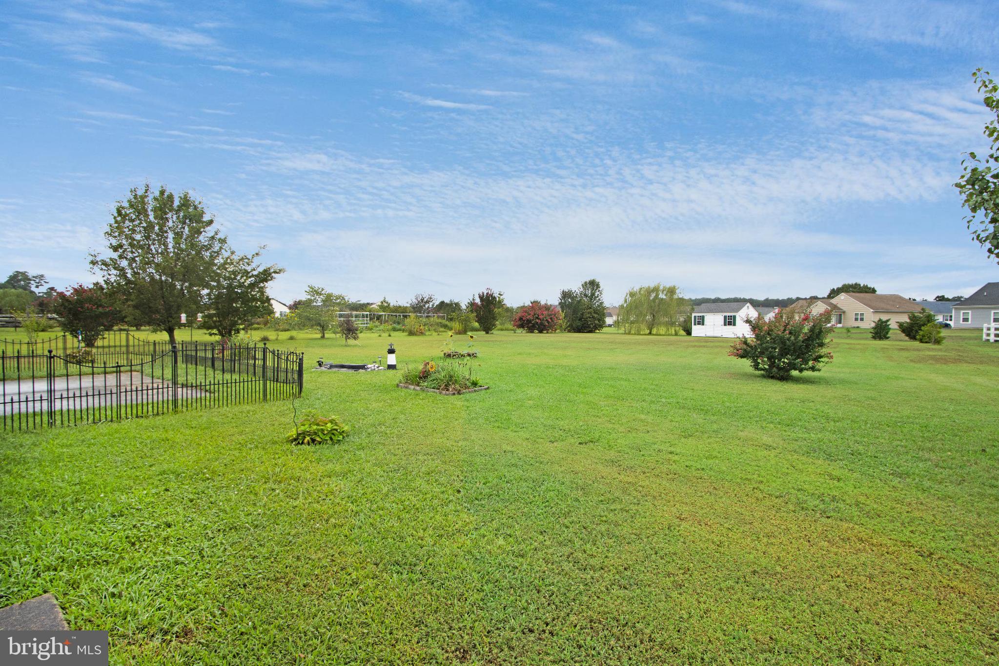 30147 Regatta Bay Boulevard Lewes, DE 19958 - Photo 14 of 74 Spacious green landscape under a clear sky.