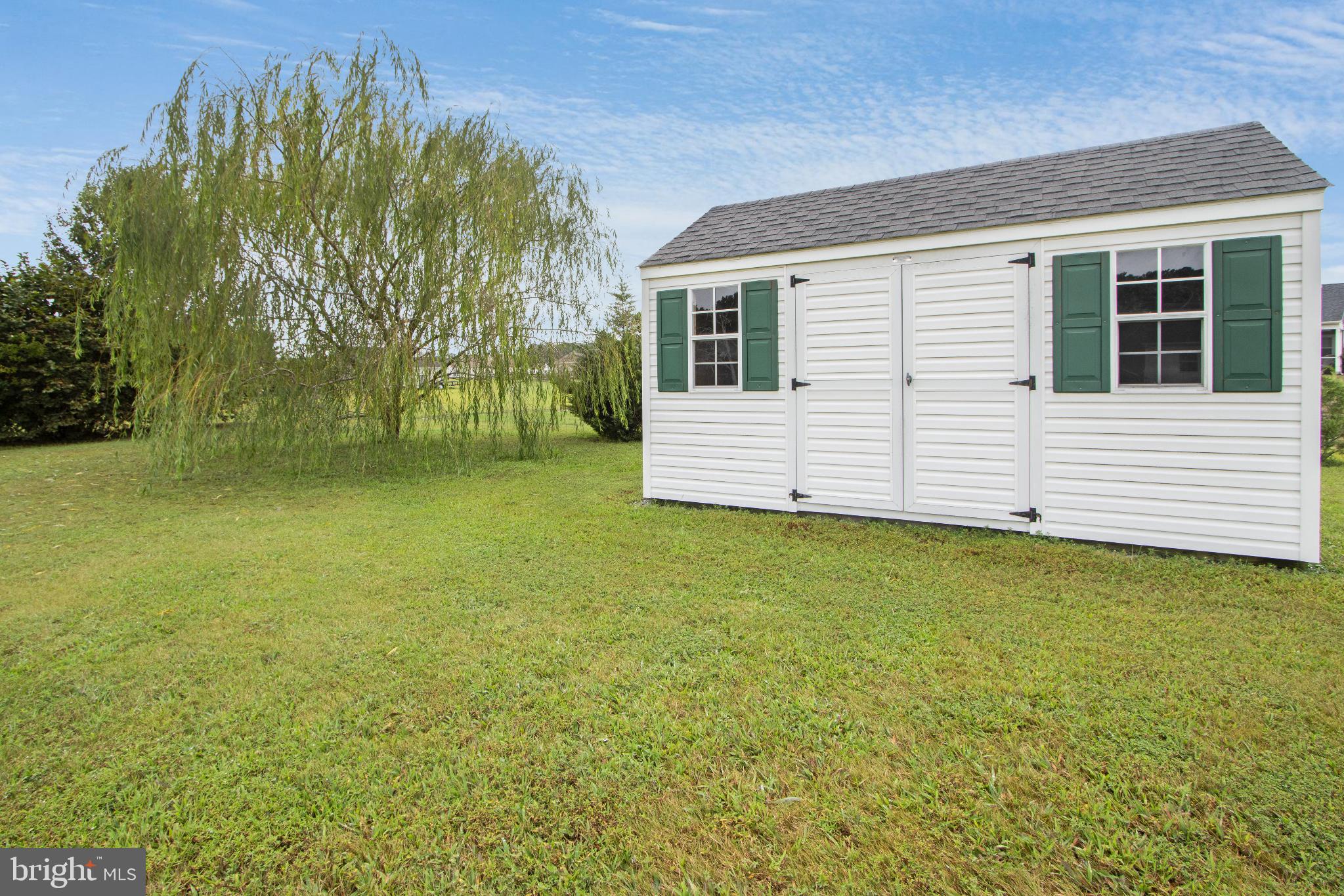 30147 Regatta Bay Boulevard Lewes, DE 19958 - Photo 18 of 74 a view of a backyard with a garden