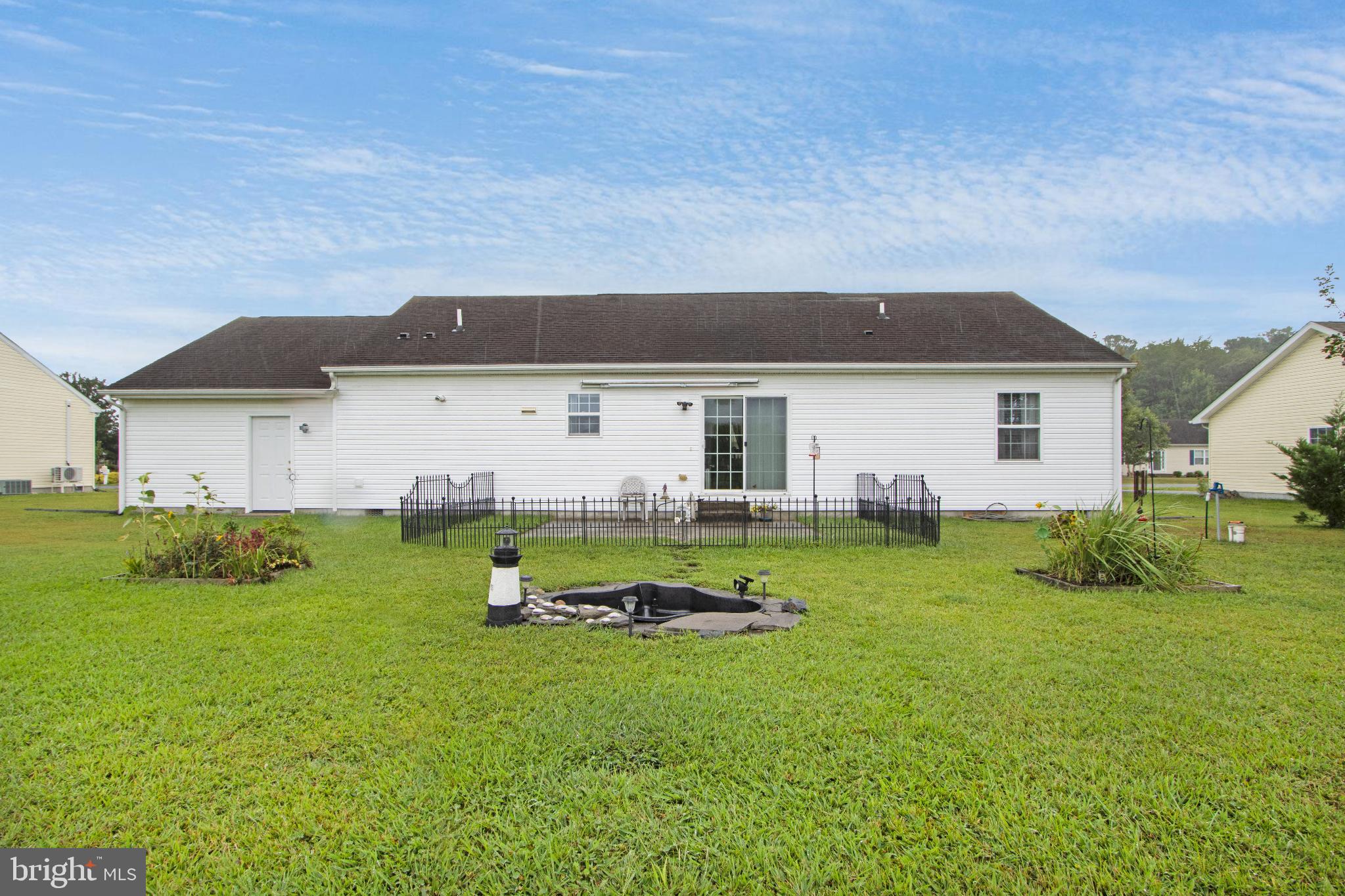 30147 Regatta Bay Boulevard Lewes, DE 19958 - Photo 20 of 74 a house view with a garden space