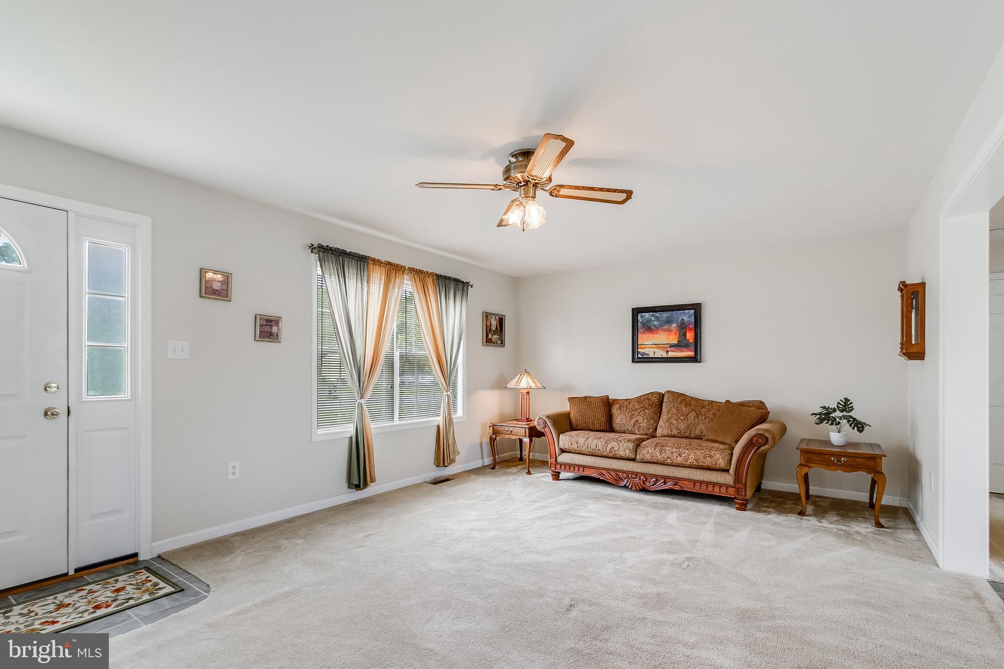 30147 Regatta Bay Boulevard Lewes, DE 19958 - Photo 22 of 74 a living room with furniture and a window