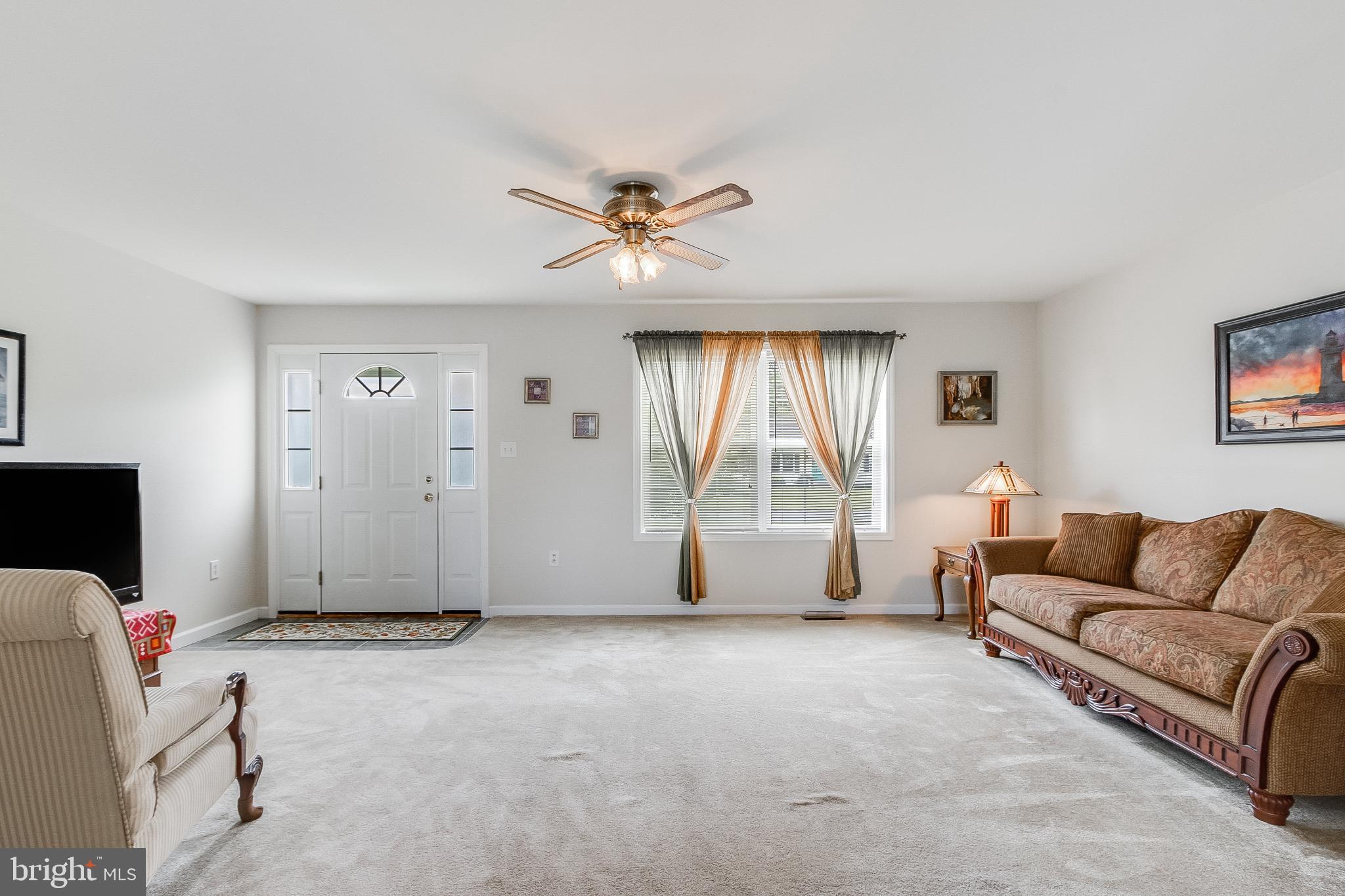 30147 Regatta Bay Boulevard Lewes, DE 19958 - Photo 26 of 74 a living room with furniture and a window
