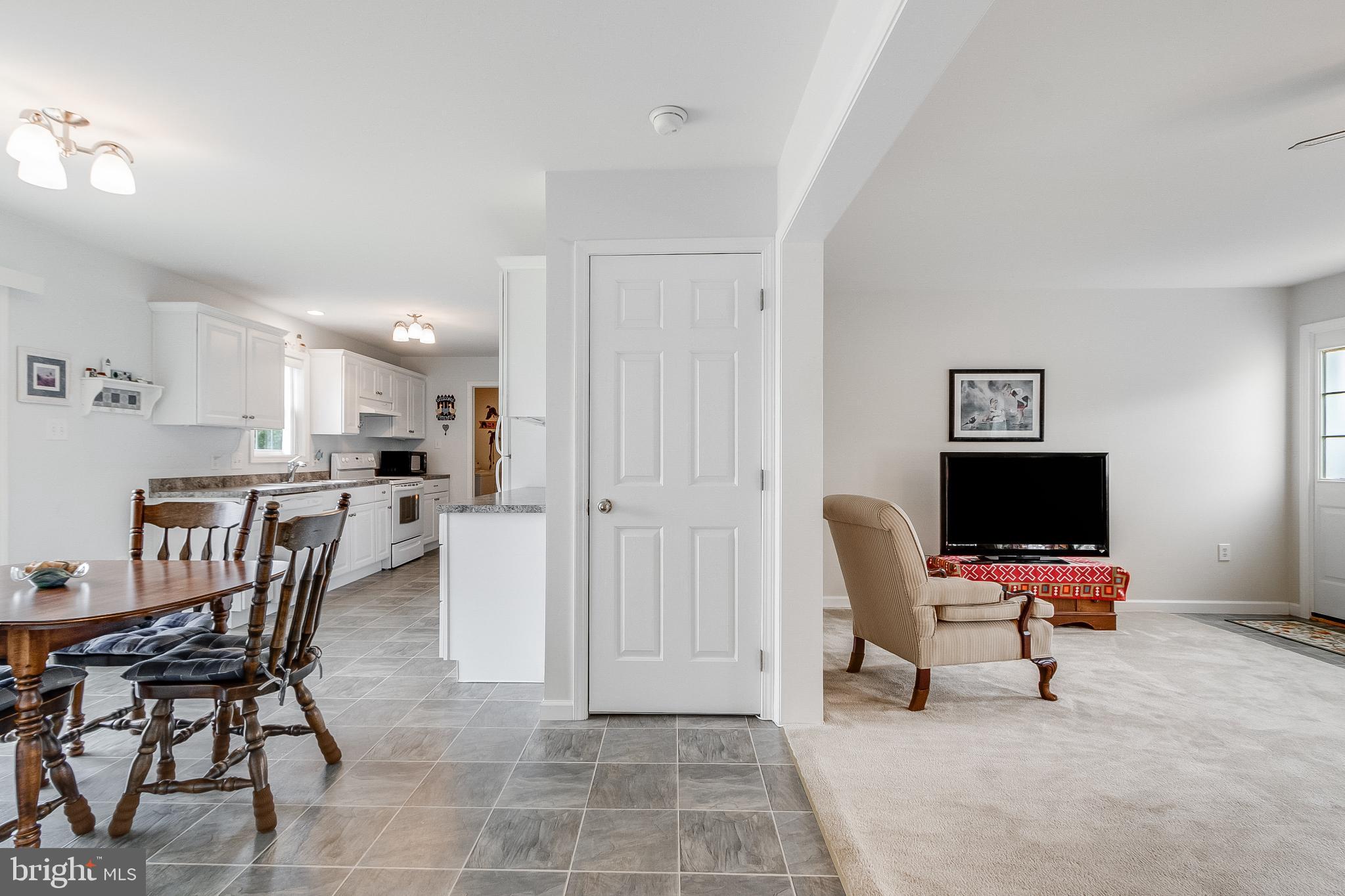 30147 Regatta Bay Boulevard Lewes, DE 19958 - Photo 29 of 74 a view of a workspace with furniture and a window