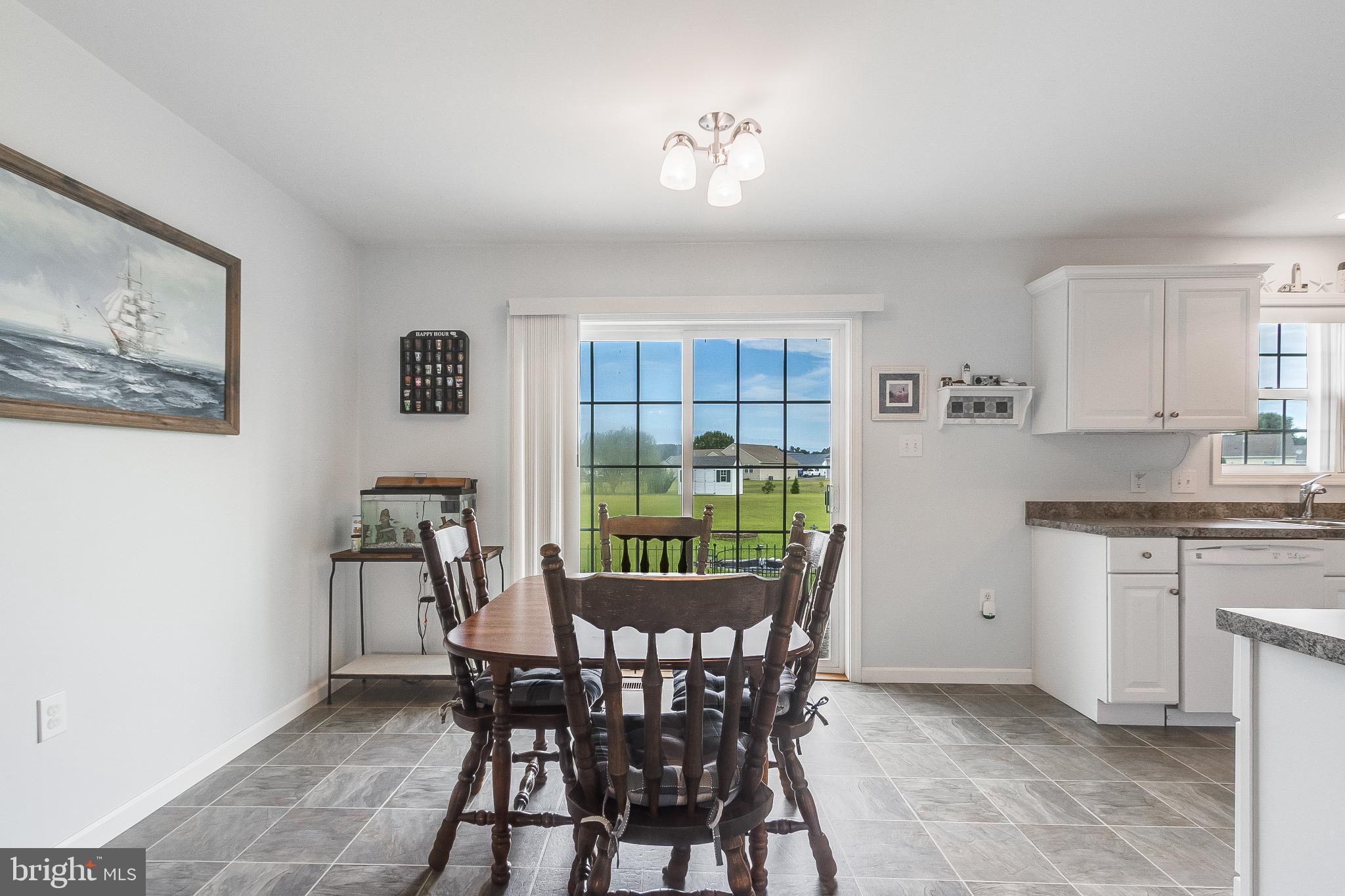 30147 Regatta Bay Boulevard Lewes, DE 19958 - Photo 30 of 74 a view of a dining room with furniture and window