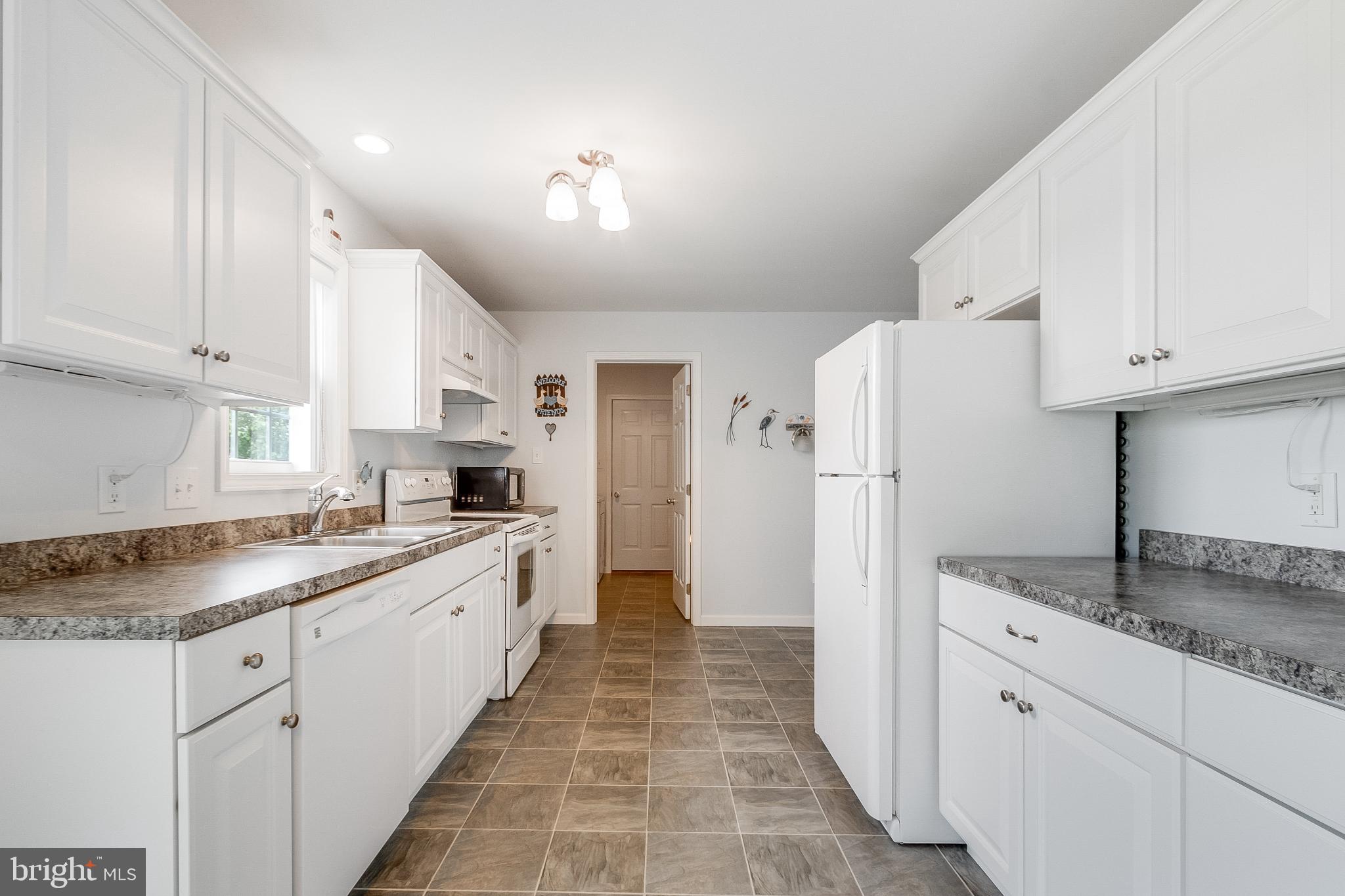 30147 Regatta Bay Boulevard Lewes, DE 19958 - Photo 38 of 74 Bright and airy kitchen with modern finishes.