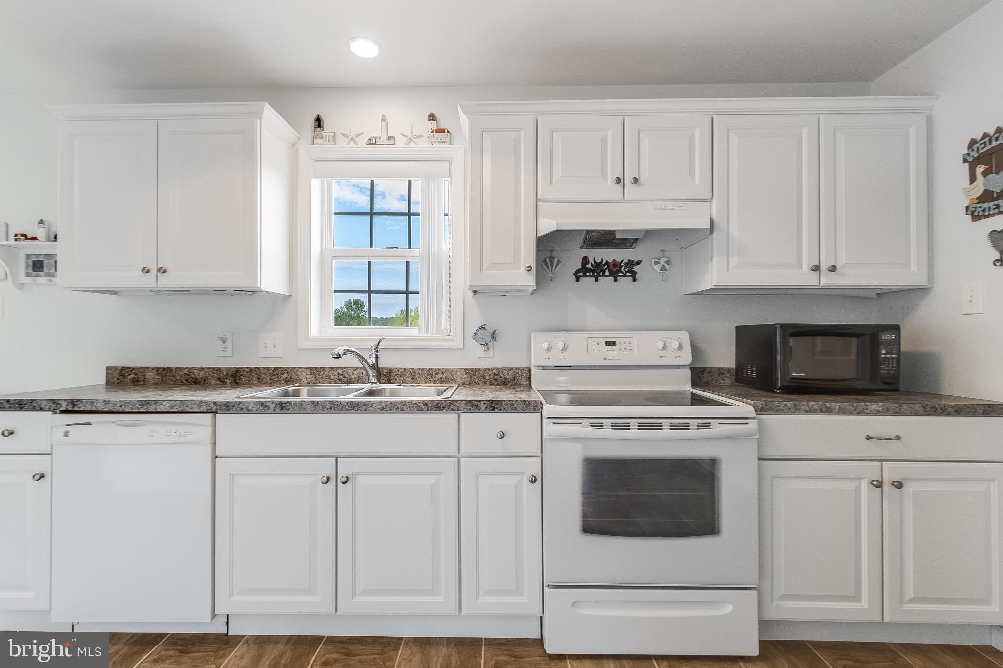 30147 Regatta Bay Boulevard Lewes, DE 19958 - Photo 40 of 74 Bright and airy kitchen with many cabinets