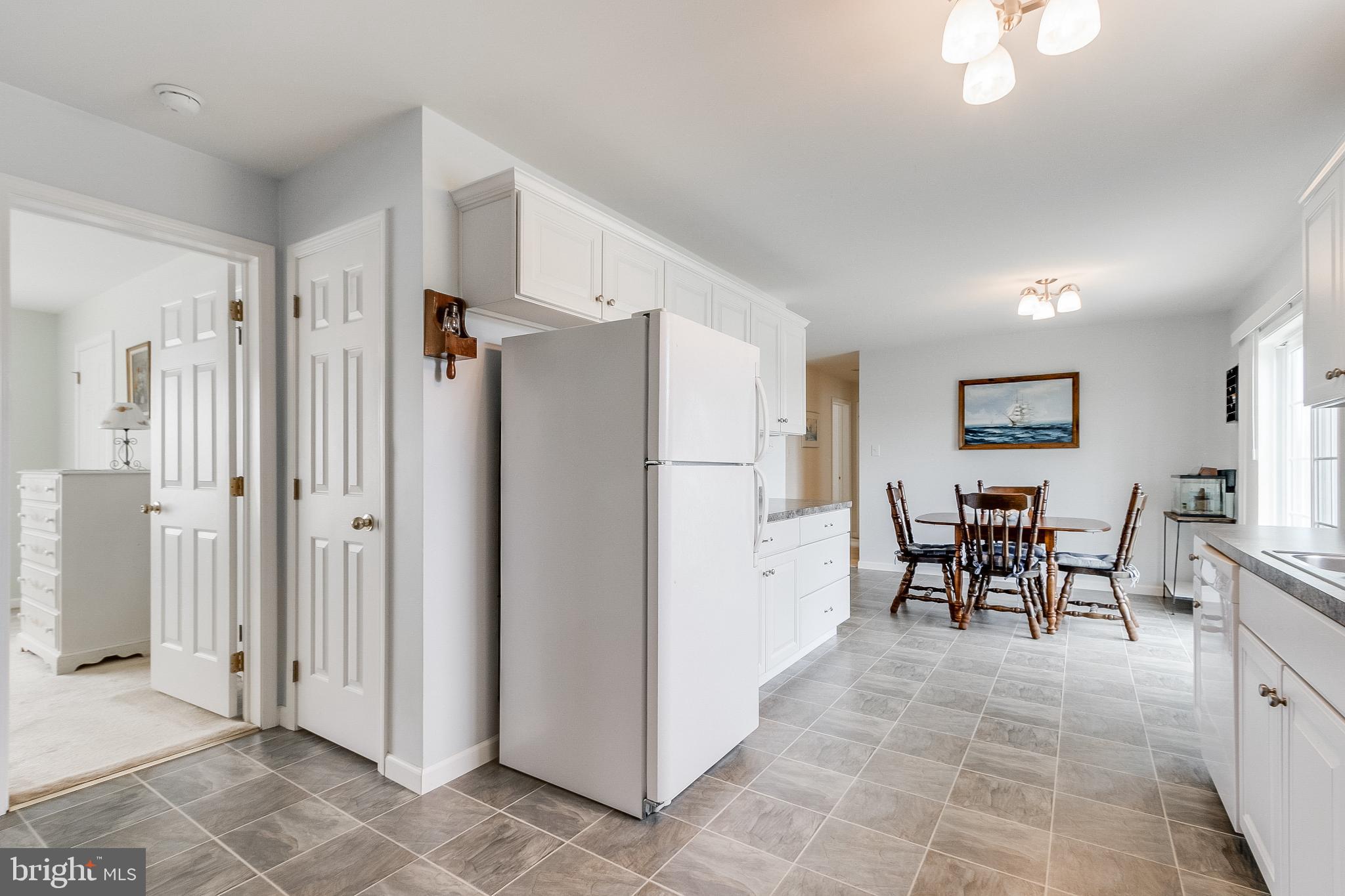 30147 Regatta Bay Boulevard Lewes, DE 19958 - Photo 43 of 74 a view of a kitchen and dining room