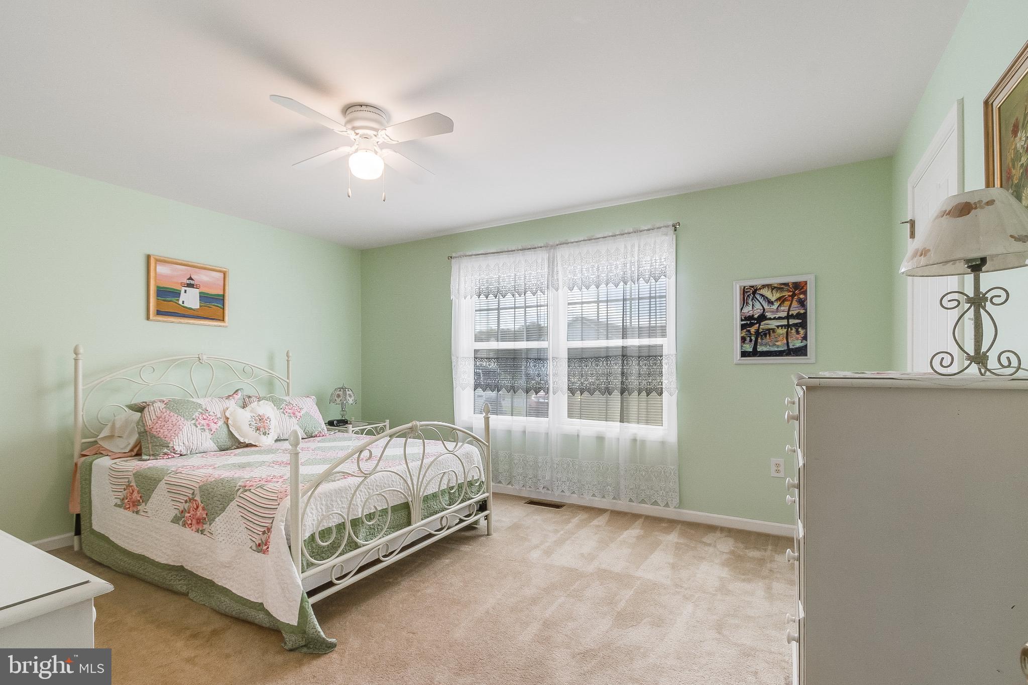 30147 Regatta Bay Boulevard Lewes, DE 19958 - Photo 45 of 74 a bedroom with a bed and a window
