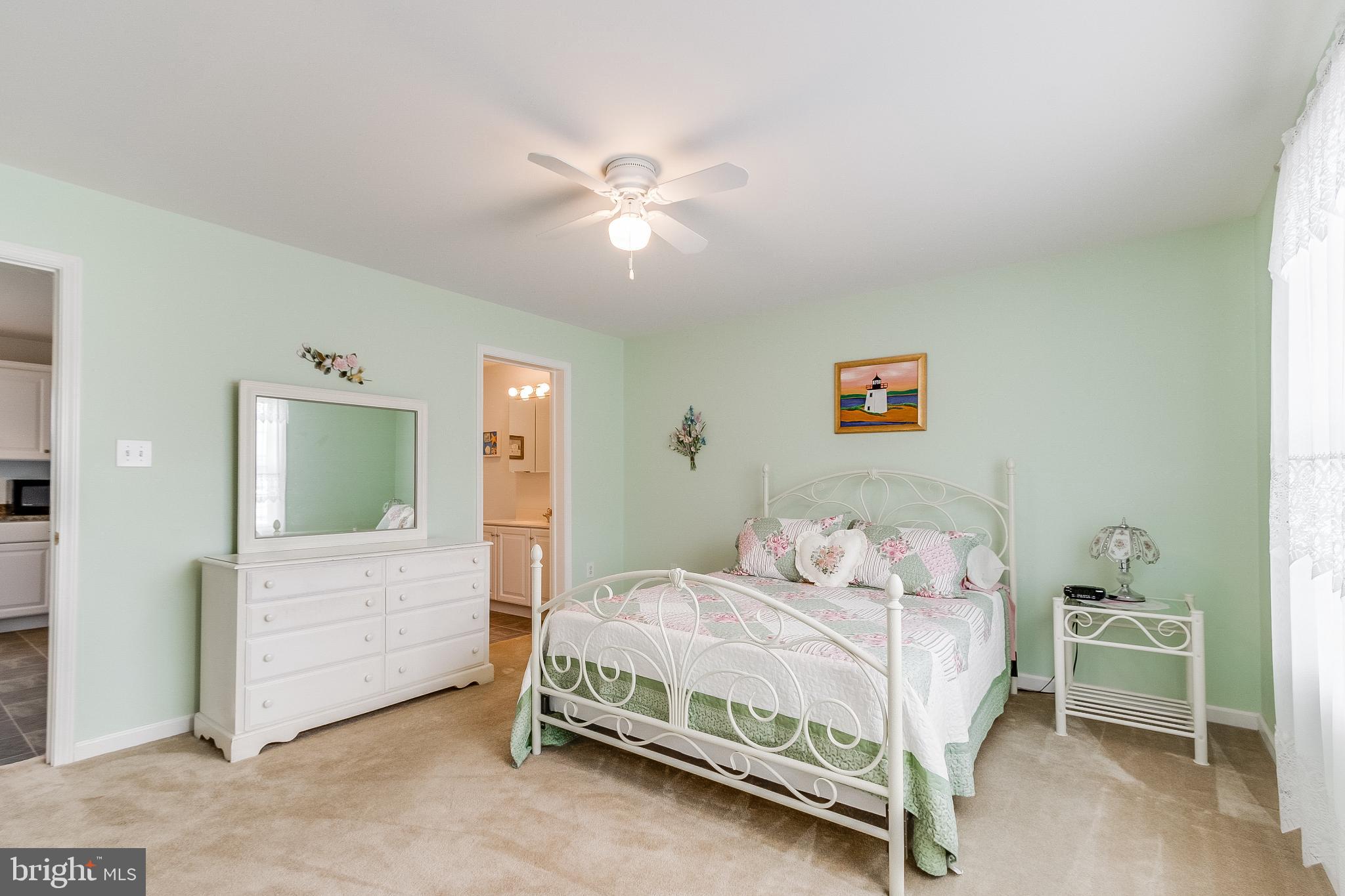 30147 Regatta Bay Boulevard Lewes, DE 19958 - Photo 46 of 74 Serene pastel bedroom with natural light.