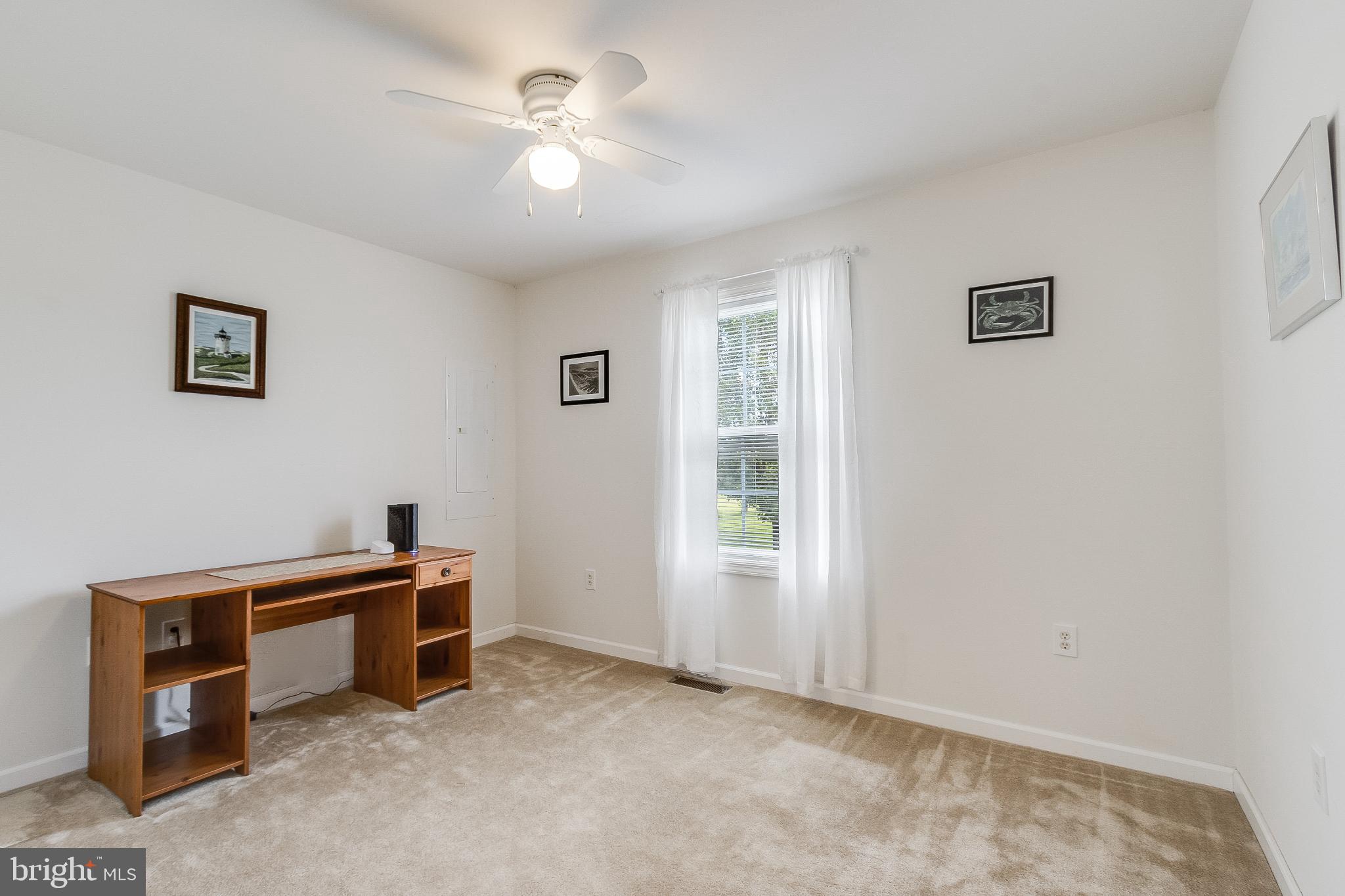 30147 Regatta Bay Boulevard Lewes, DE 19958 - Photo 54 of 74 a view of a livingroom with a workspace