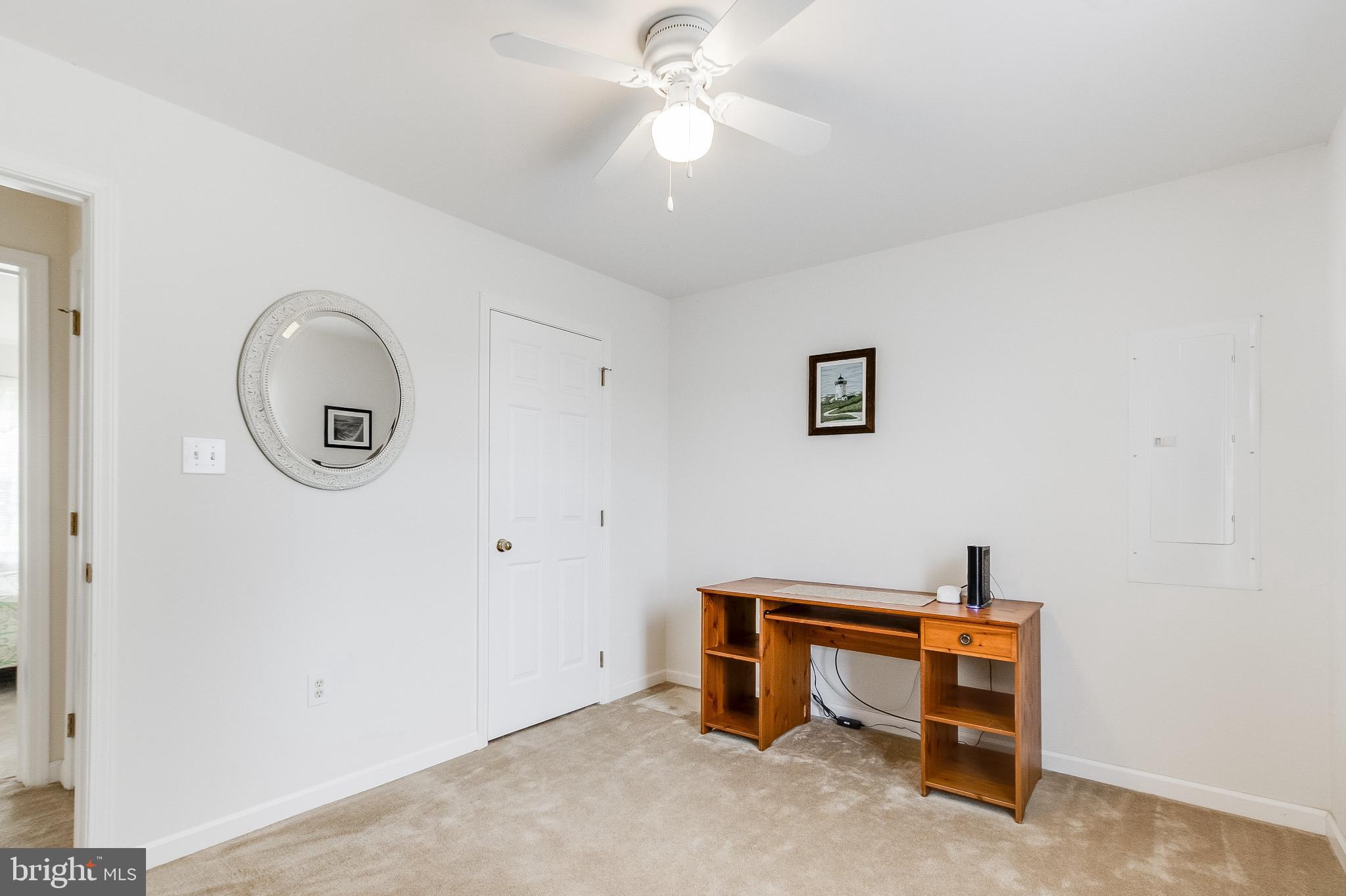 30147 Regatta Bay Boulevard Lewes, DE 19958 - Photo 56 of 74 a room with a table and a potted plant