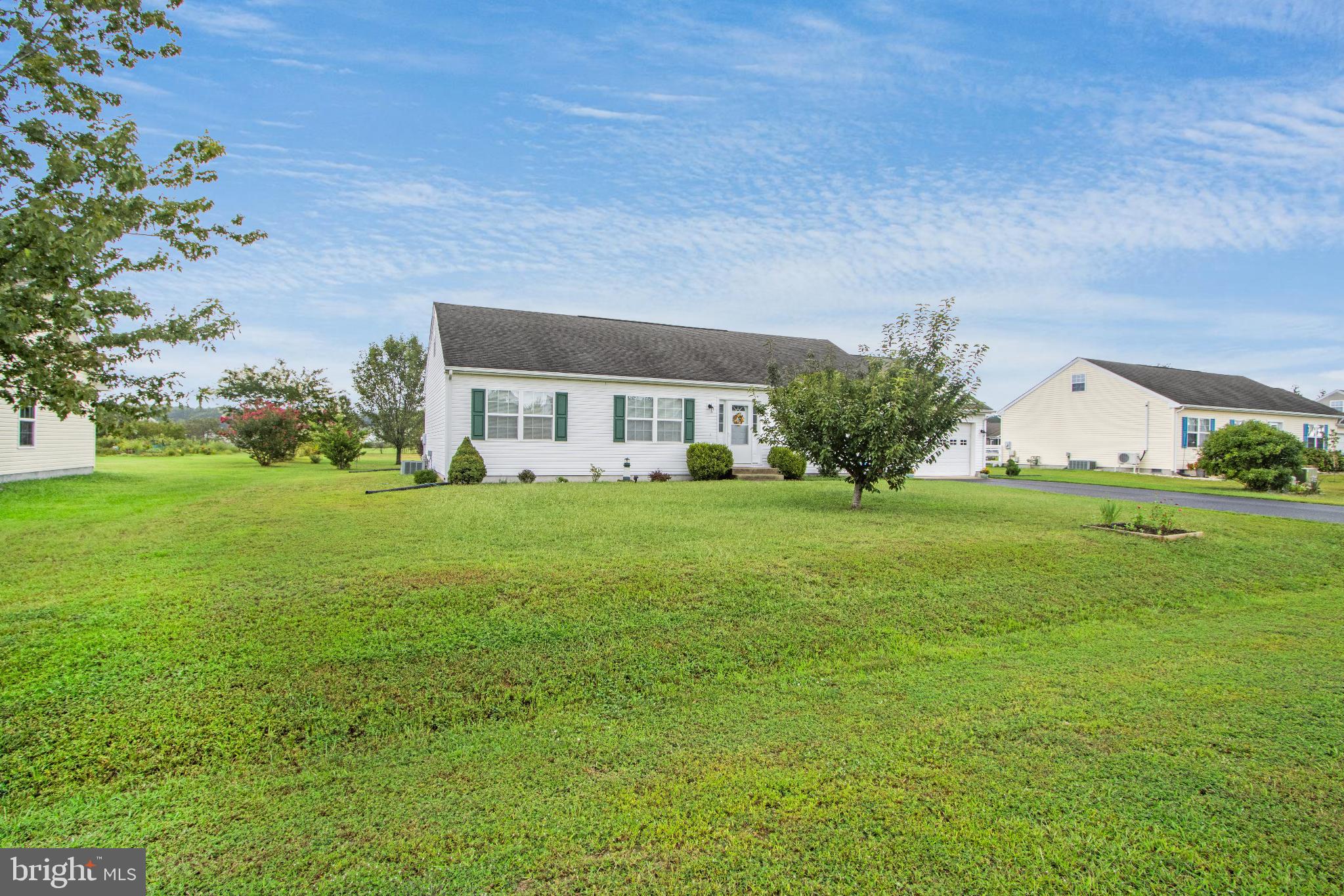 30147 Regatta Bay Boulevard Lewes, DE 19958 - Photo 8 of 74 a front view of house with garden