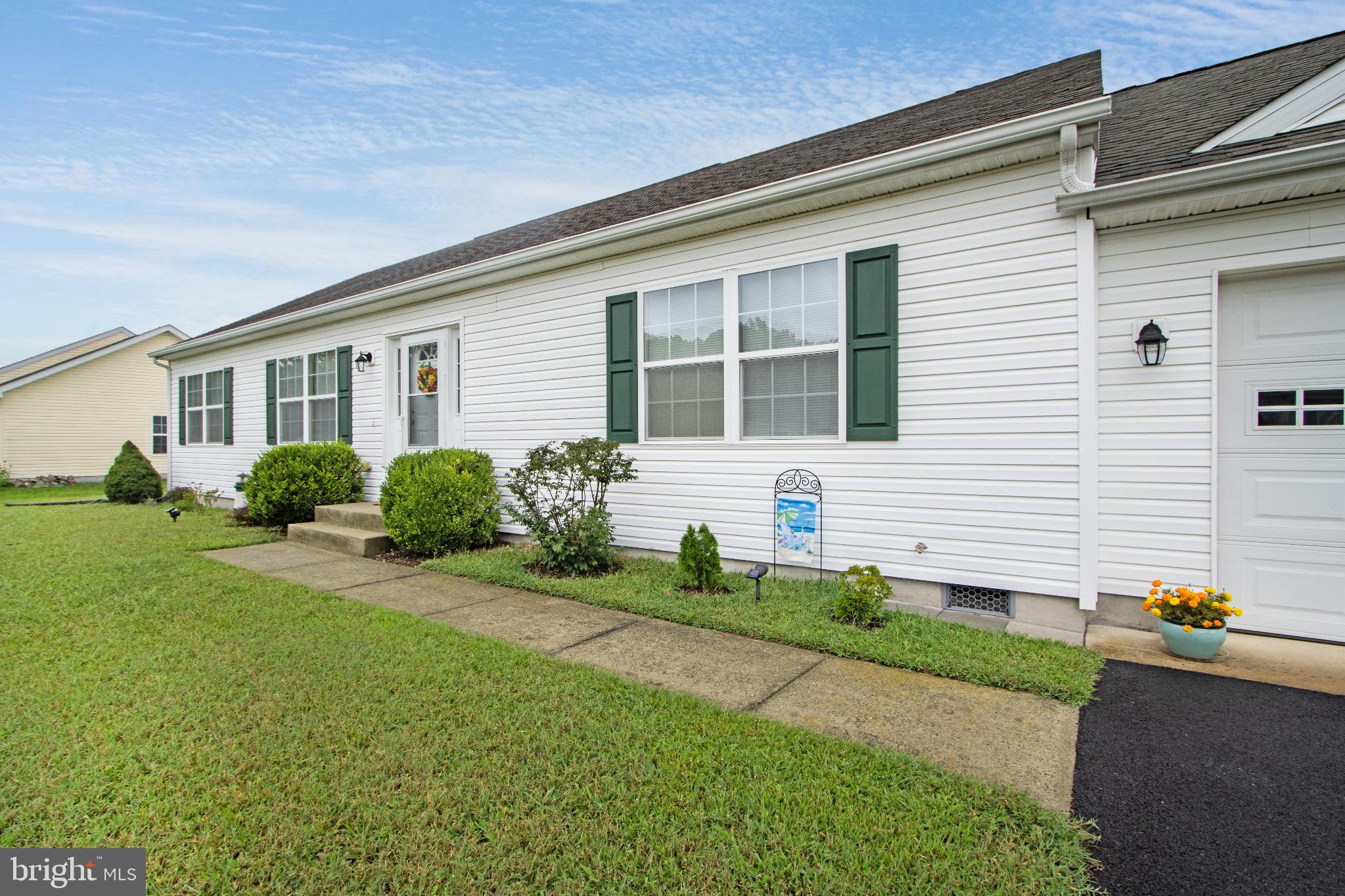 30147 Regatta Bay Boulevard Lewes, DE 19958 - Photo 10 of 74 Charming home with lush green landscaping.