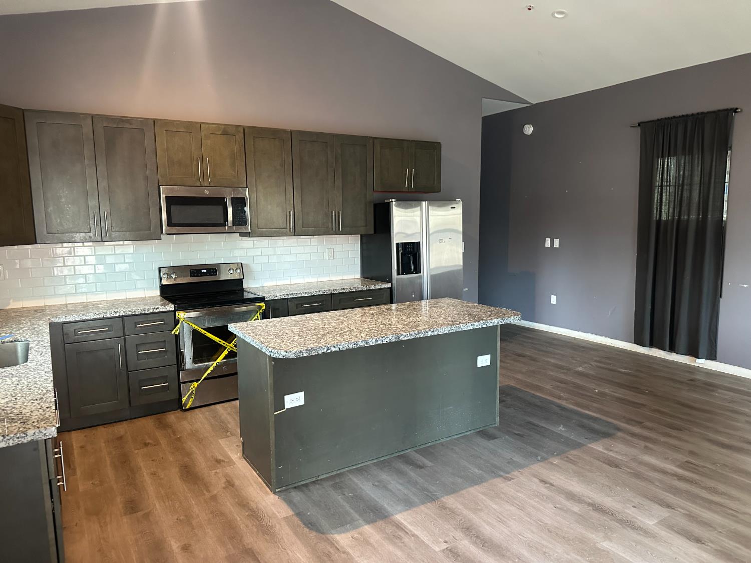 102 Shadow Wood Place Colfax, CA 95713 - Photo 5 of 15 a kitchen with kitchen island stainless steel appliances a sink stove and refrigerator