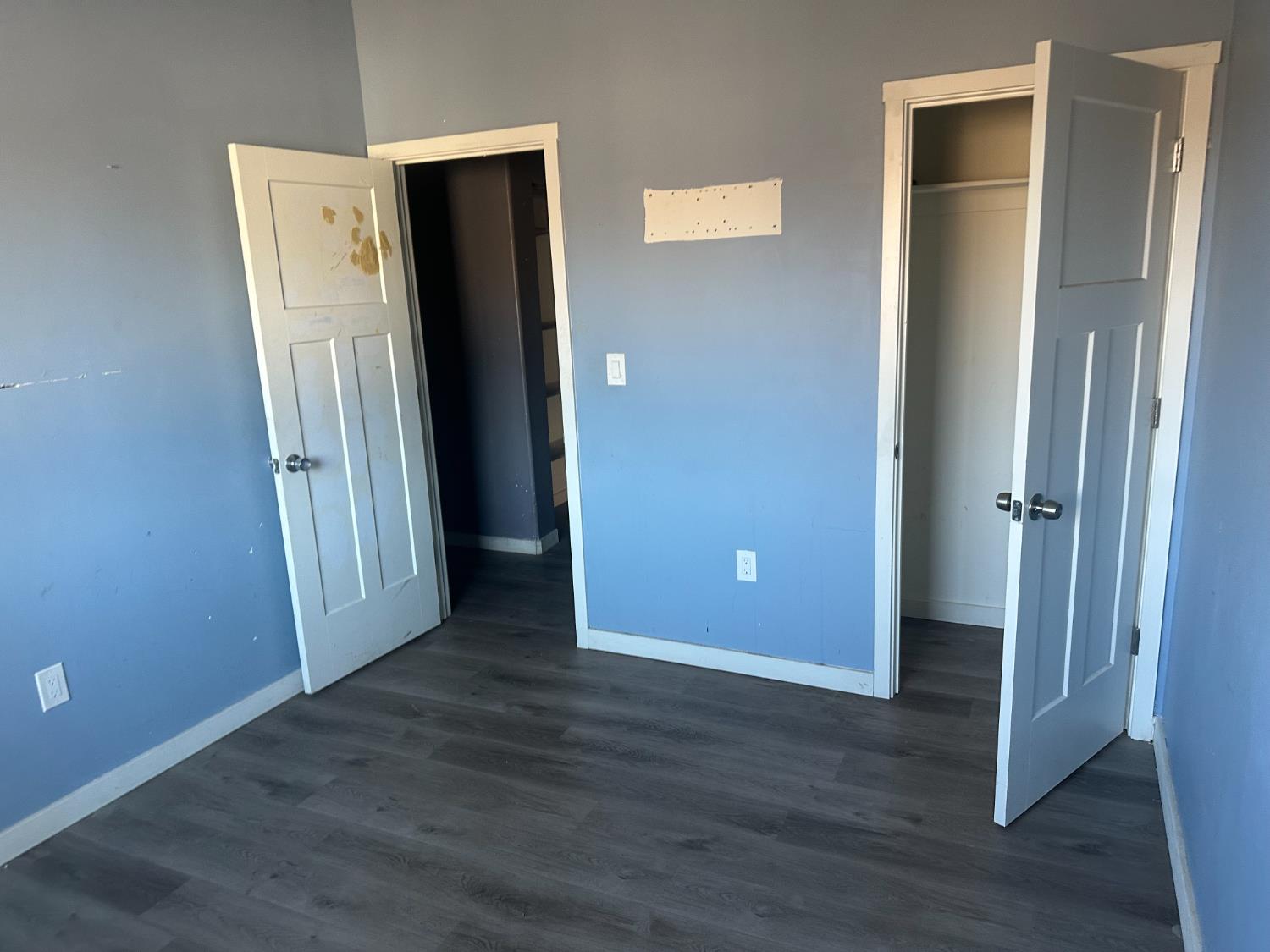 102 Shadow Wood Place Colfax, CA 95713 - Photo 9 of 15 an empty room with wooden floor and closet