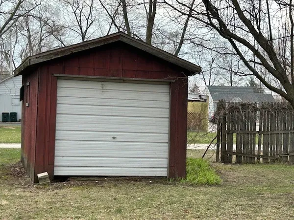 a house that has a tree in front of it