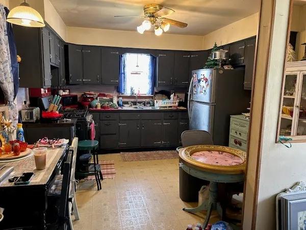 a kitchen with a sink appliances and cabinets
