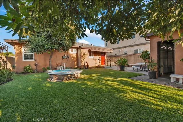 a view of a house with a yard porch and sitting area