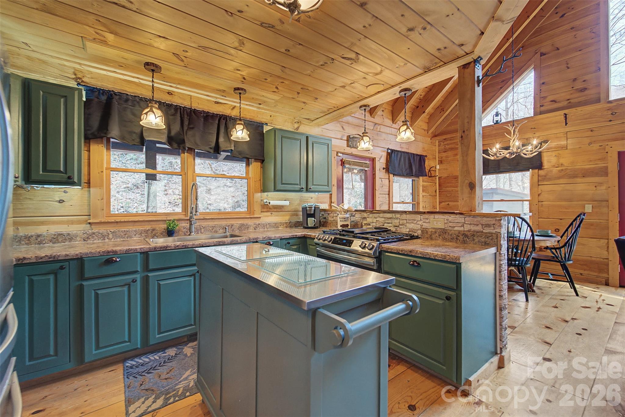 170 Wilkes Road Bryson City, NC 28713 - Photo 12 of 47 a kitchen with a stove and cabinets