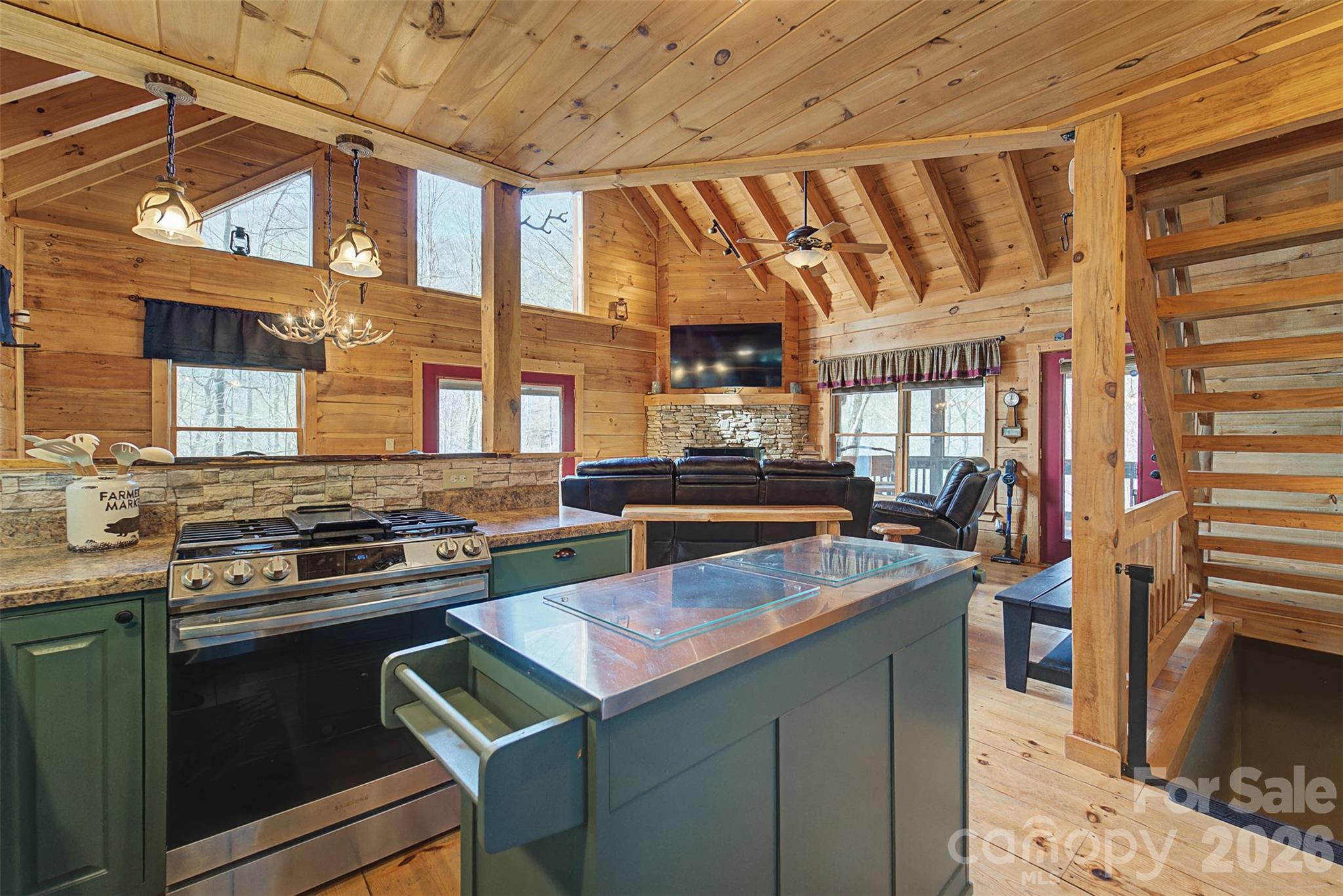 170 Wilkes Road Bryson City, NC 28713 - Photo 13 of 47 a kitchen with a stove a sink and a refrigerator