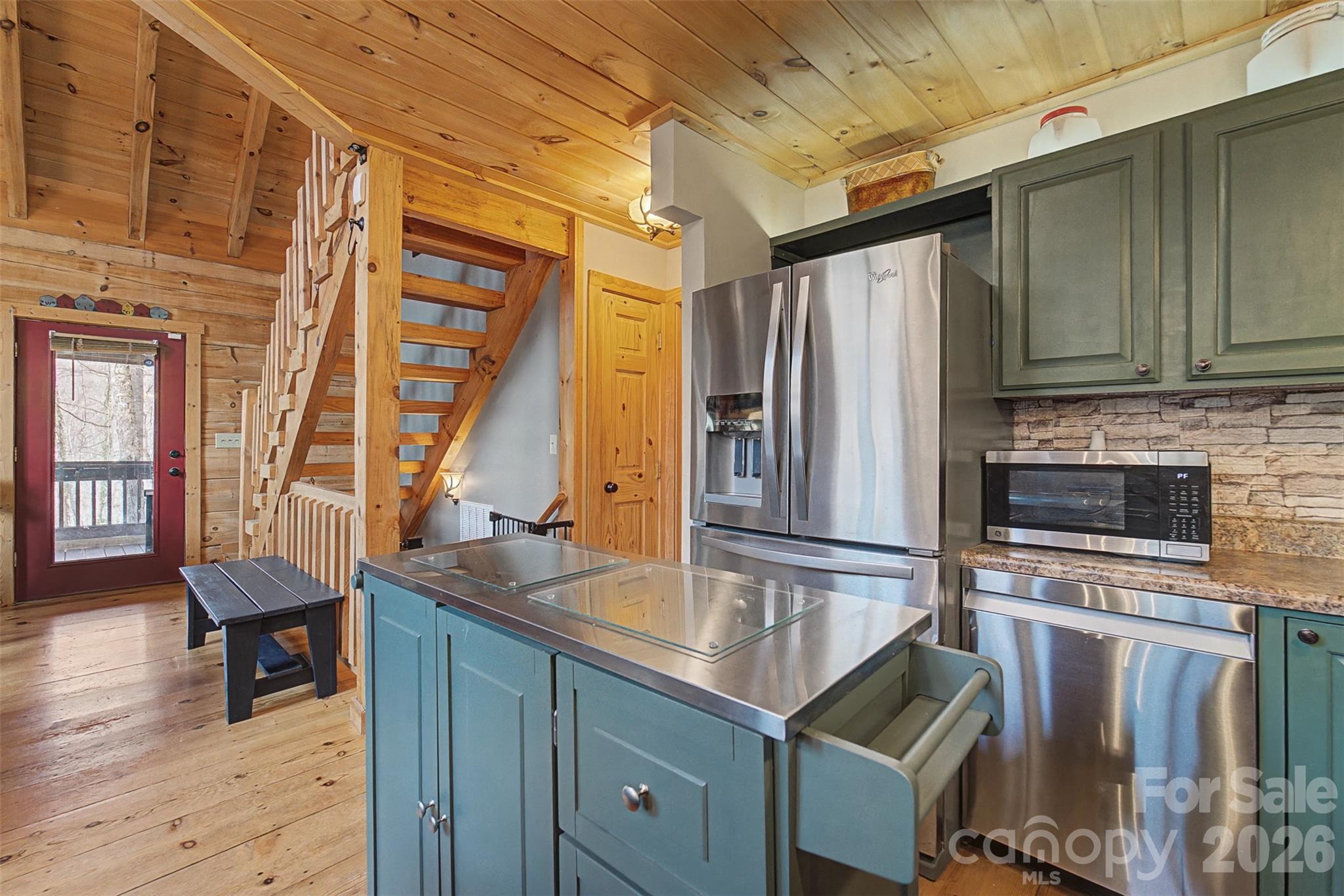 170 Wilkes Road Bryson City, NC 28713 - Photo 14 of 47 a kitchen with kitchen island granite countertop a sink appliances and cabinets