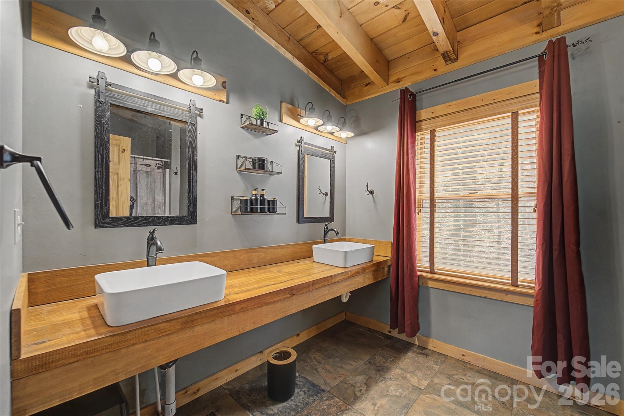 170 Wilkes Road Bryson City, NC 28713 - Photo 25 of 47 a bathroom with a sink and a mirror