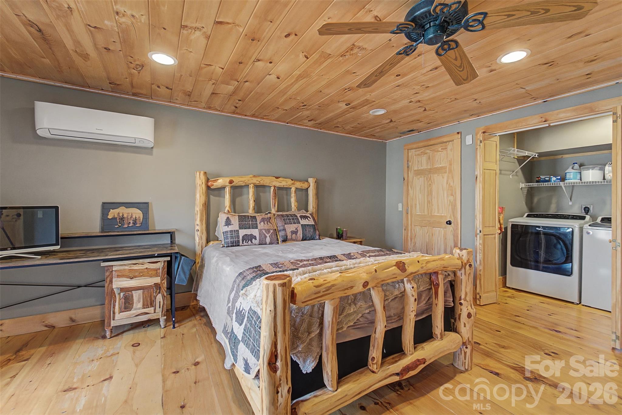 170 Wilkes Road Bryson City, NC 28713 - Photo 27 of 47 a bedroom with a bed and a chandelier