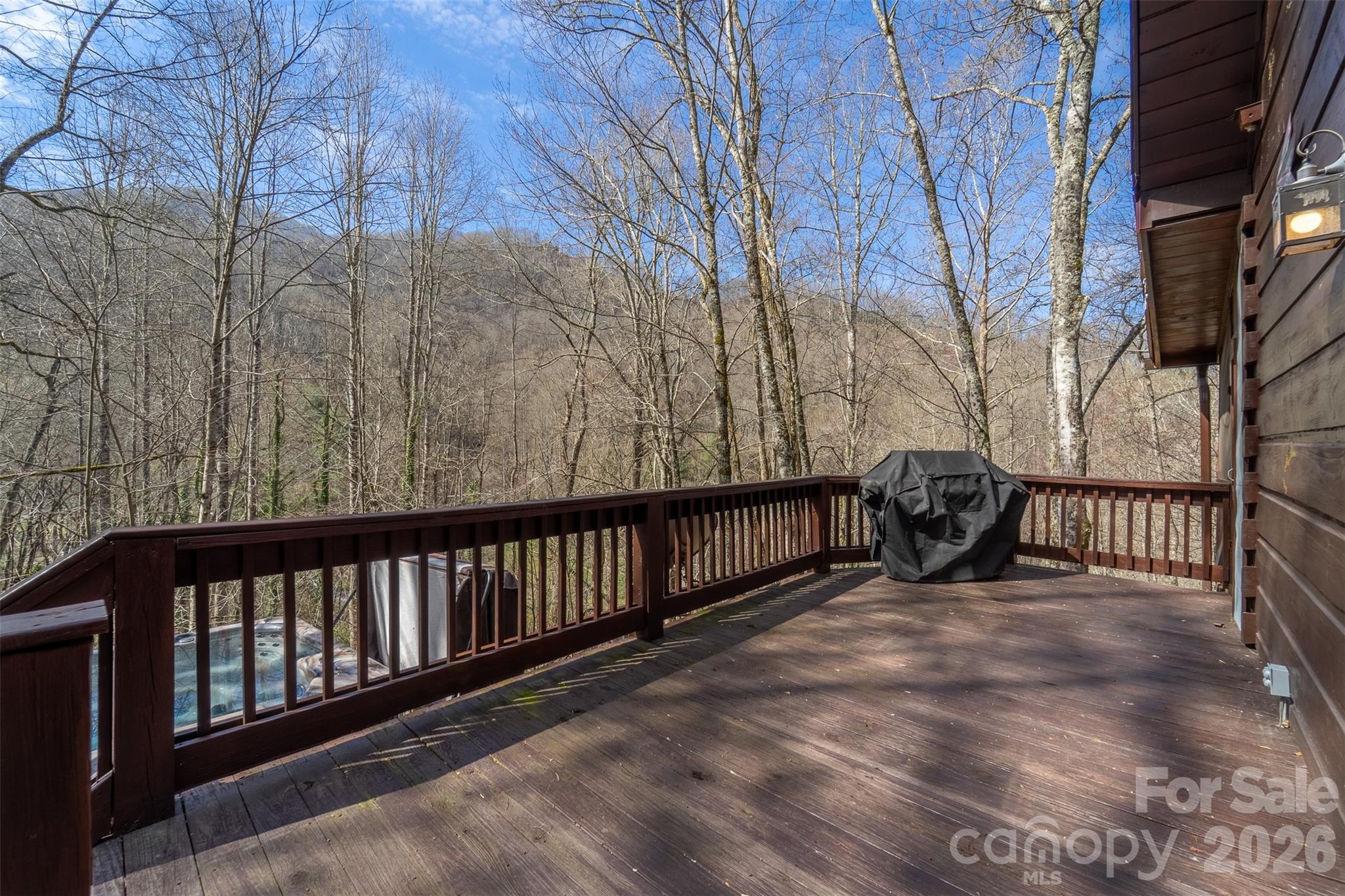 170 Wilkes Road Bryson City, NC 28713 - Photo 30 of 47 a view of a roof deck with wooden fence and floor