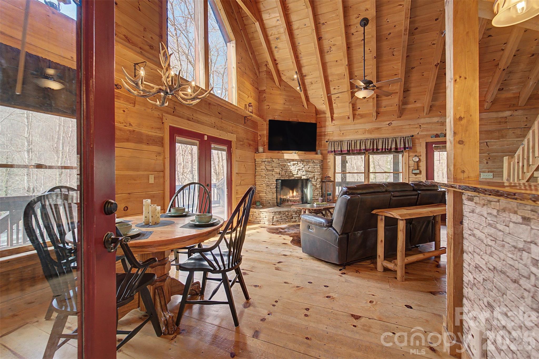 170 Wilkes Road Bryson City, NC 28713 - Photo 5 of 47 a view of a dinning tables and chairs in the patio