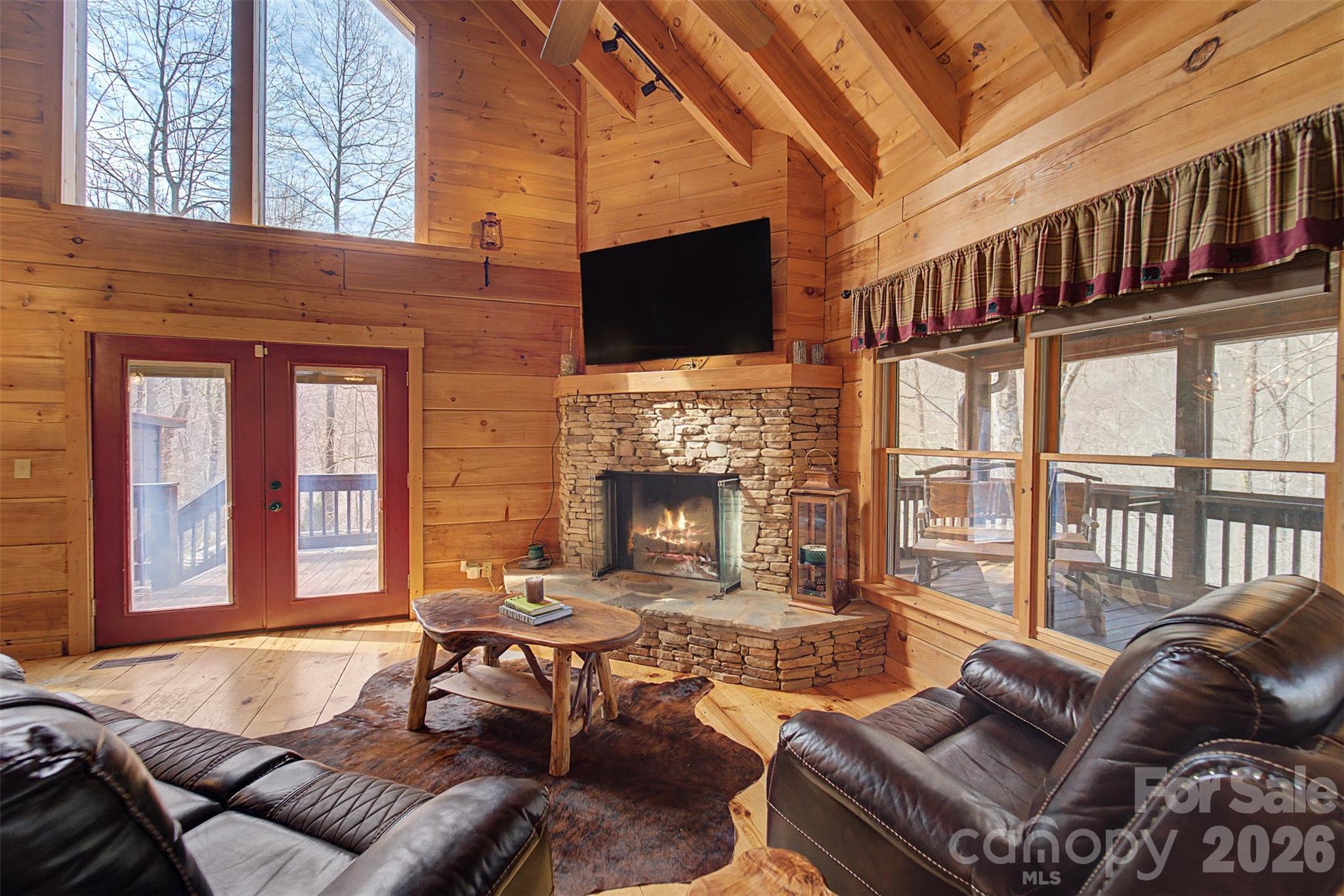 170 Wilkes Road Bryson City, NC 28713 - Photo 7 of 47 a living room with furniture fireplace and flat screen tv