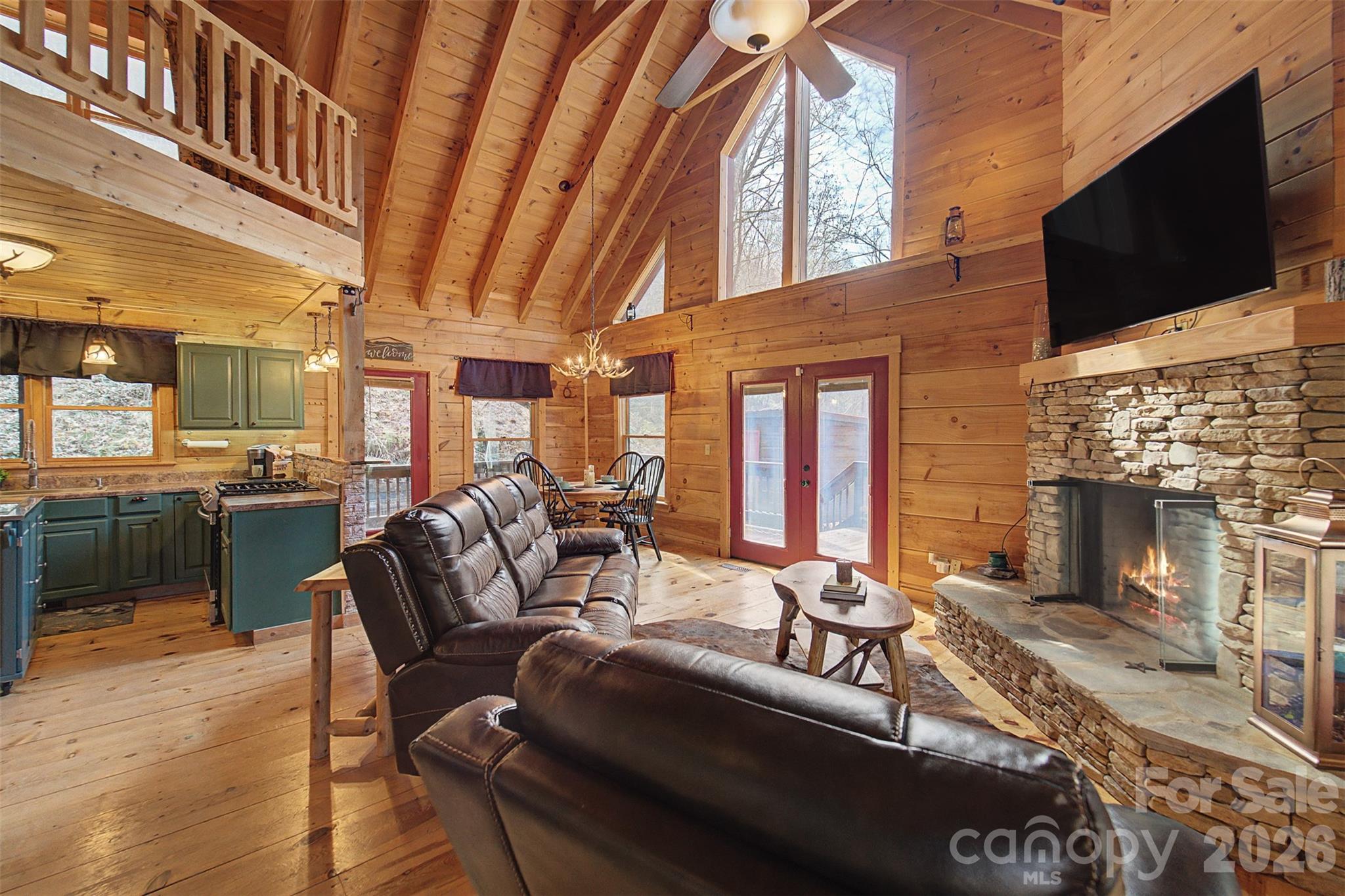 170 Wilkes Road Bryson City, NC 28713 - Photo 8 of 47 a view of a livingroom with furniture and a fireplace