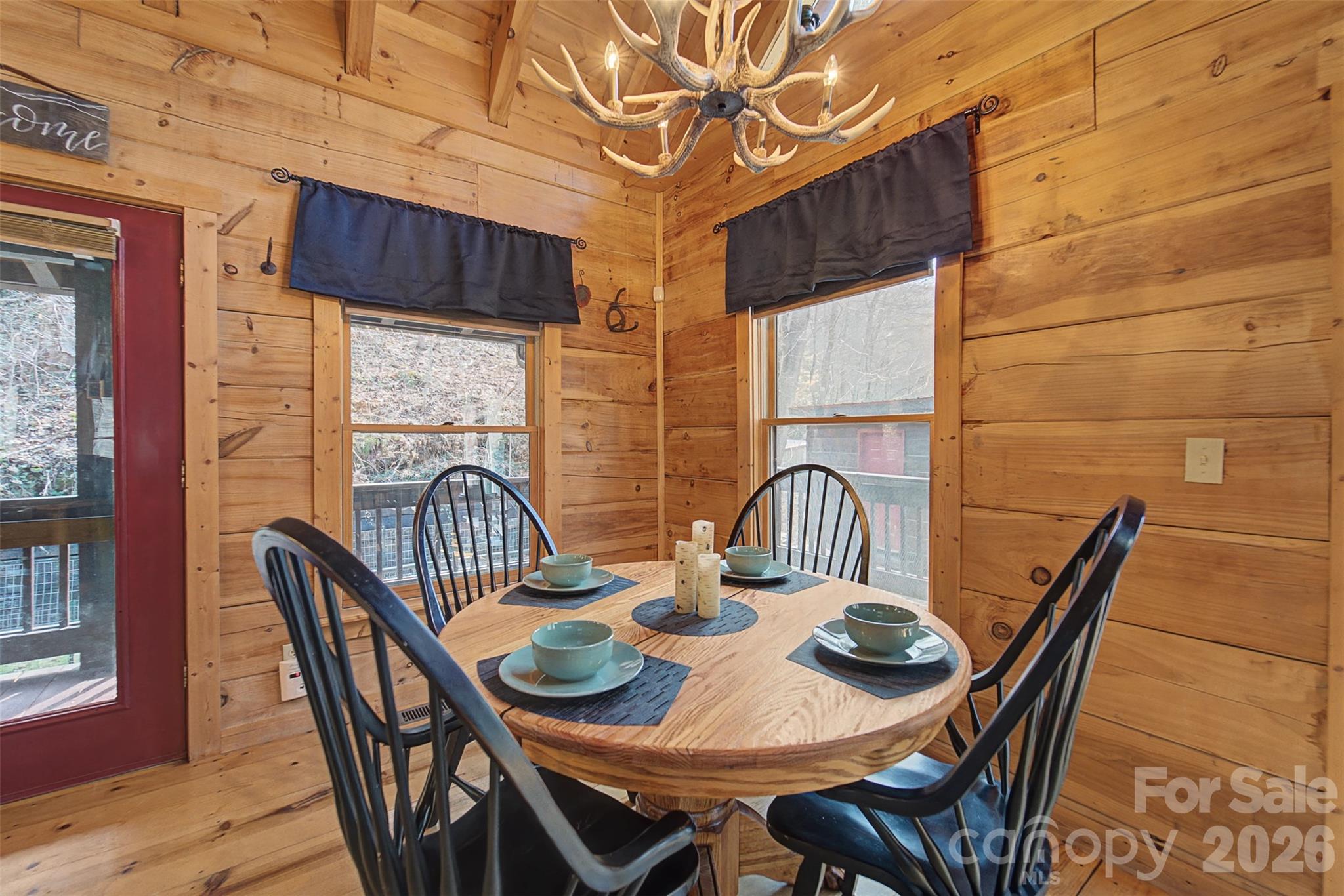 170 Wilkes Road Bryson City, NC 28713 - Photo 10 of 47 a view of a dining room with furniture window and wooden floor