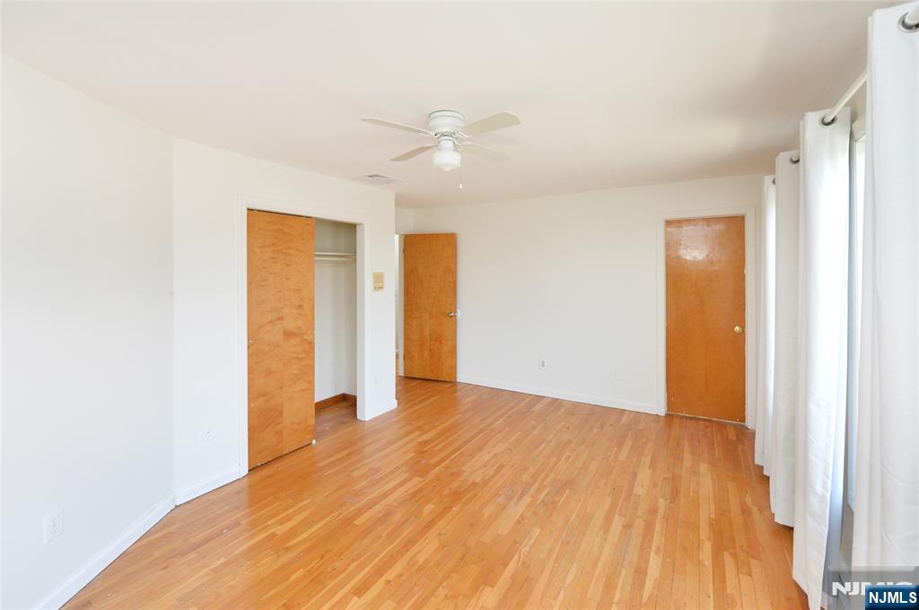 73 South Prospect Avenue Hackensack, NJ 07601 - Photo 14 of 28 a view of an empty room with wooden floor