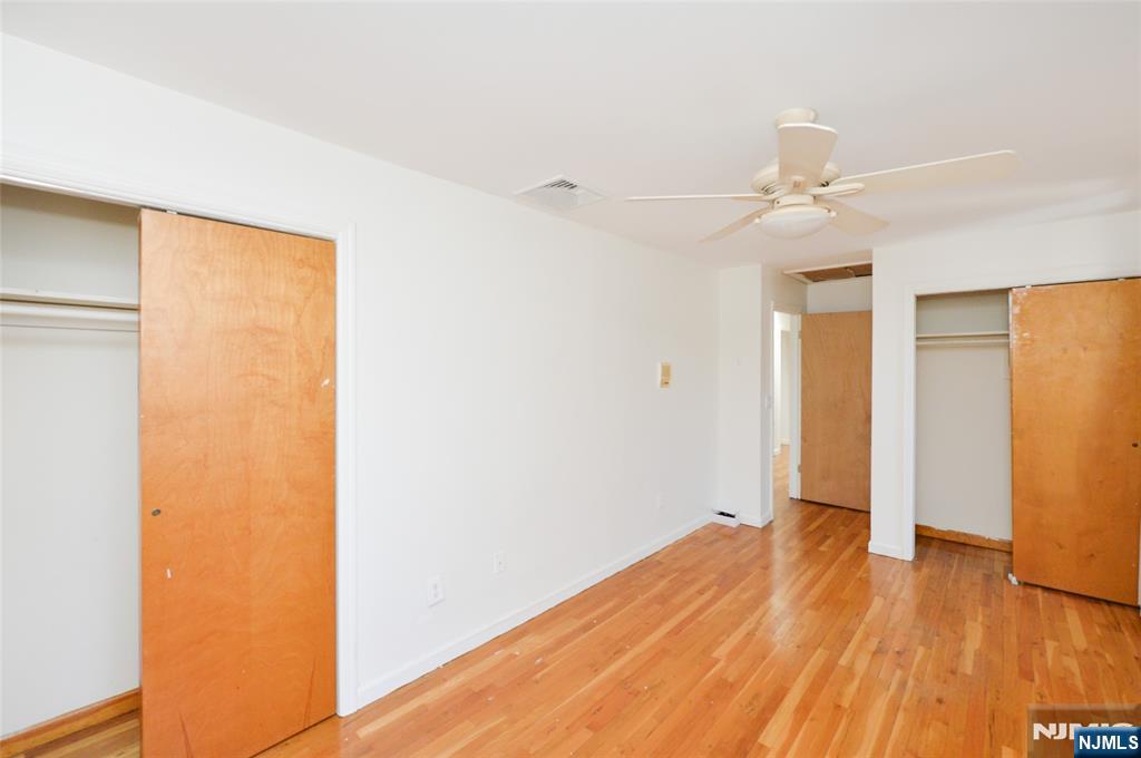 73 South Prospect Avenue Hackensack, NJ 07601 - Photo 18 of 28 a view of empty room with wooden floor and fan