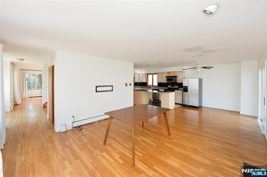 73 South Prospect Avenue Hackensack, NJ 07601 - Photo 10 of 28 a view of a kitchen with furniture and wooden floor