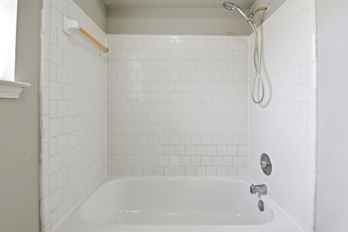 22910 Sherioaks Lane Spring, TX 77389 - Photo 15 of 27 a close up of a bathtub curtain