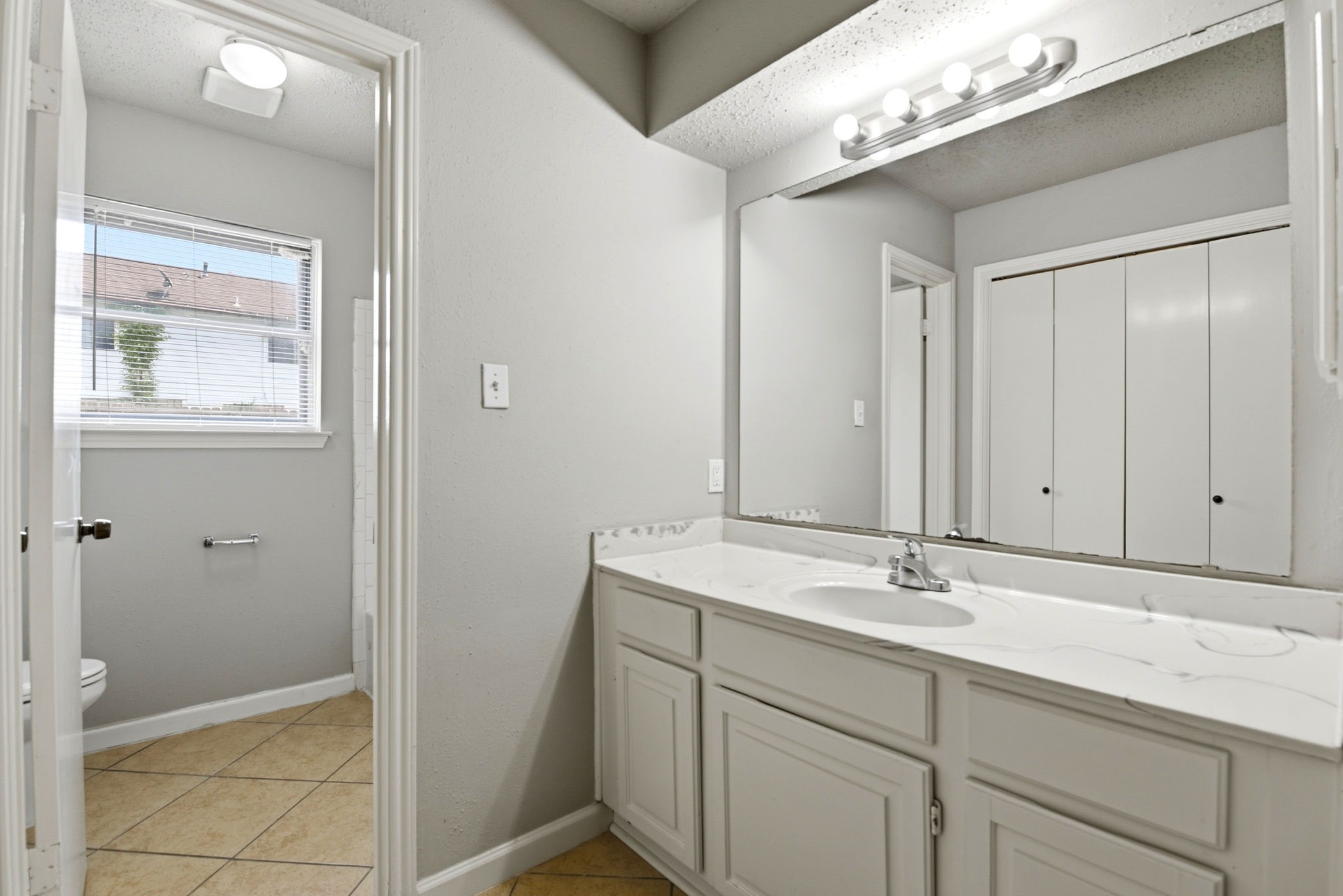 22910 Sherioaks Lane Spring, TX 77389 - Photo 16 of 27 a bathroom with a sink and a mirror