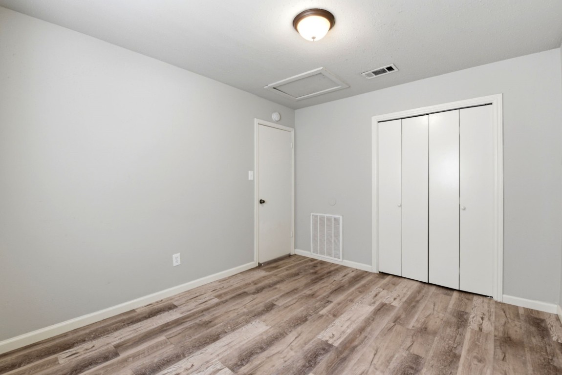 22910 Sherioaks Lane Spring, TX 77389 - Photo 20 of 27 an empty room with wooden floor