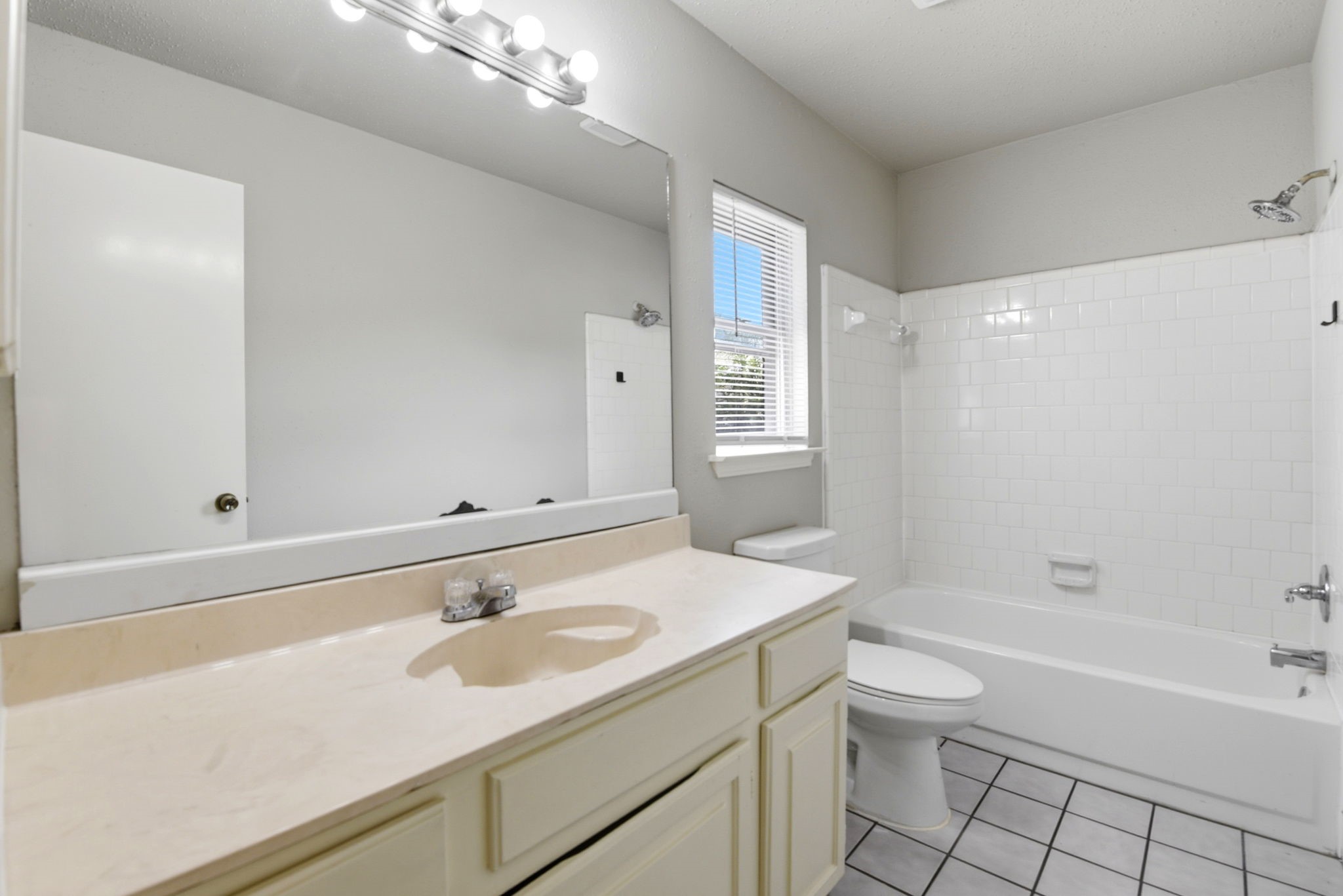 22910 Sherioaks Lane Spring, TX 77389 - Photo 23 of 27 a bathroom with a sink a toilet and shower