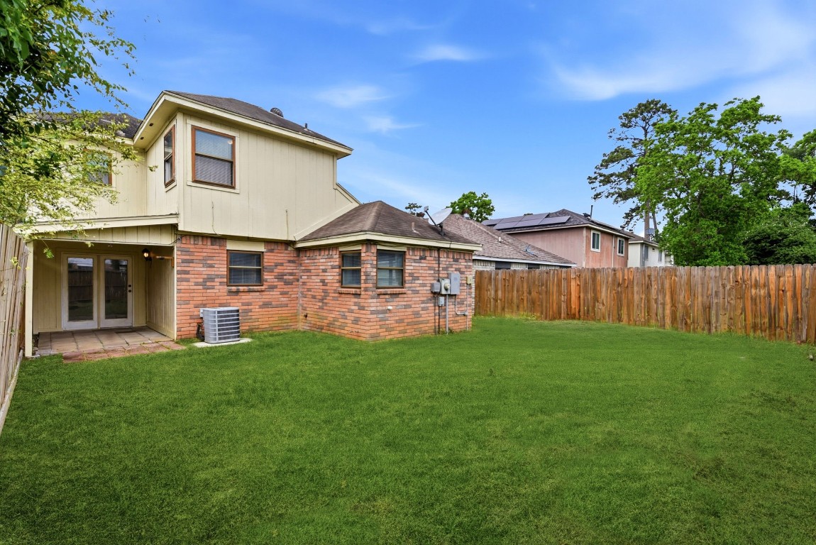 22910 Sherioaks Lane Spring, TX 77389 - Photo 27 of 27 a front view of a house with a garden