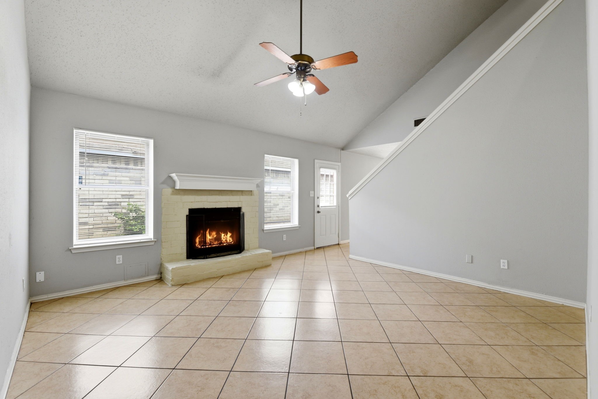 22910 Sherioaks Lane Spring, TX 77389 - Photo 5 of 27 a view of an empty room with a window and a fireplace