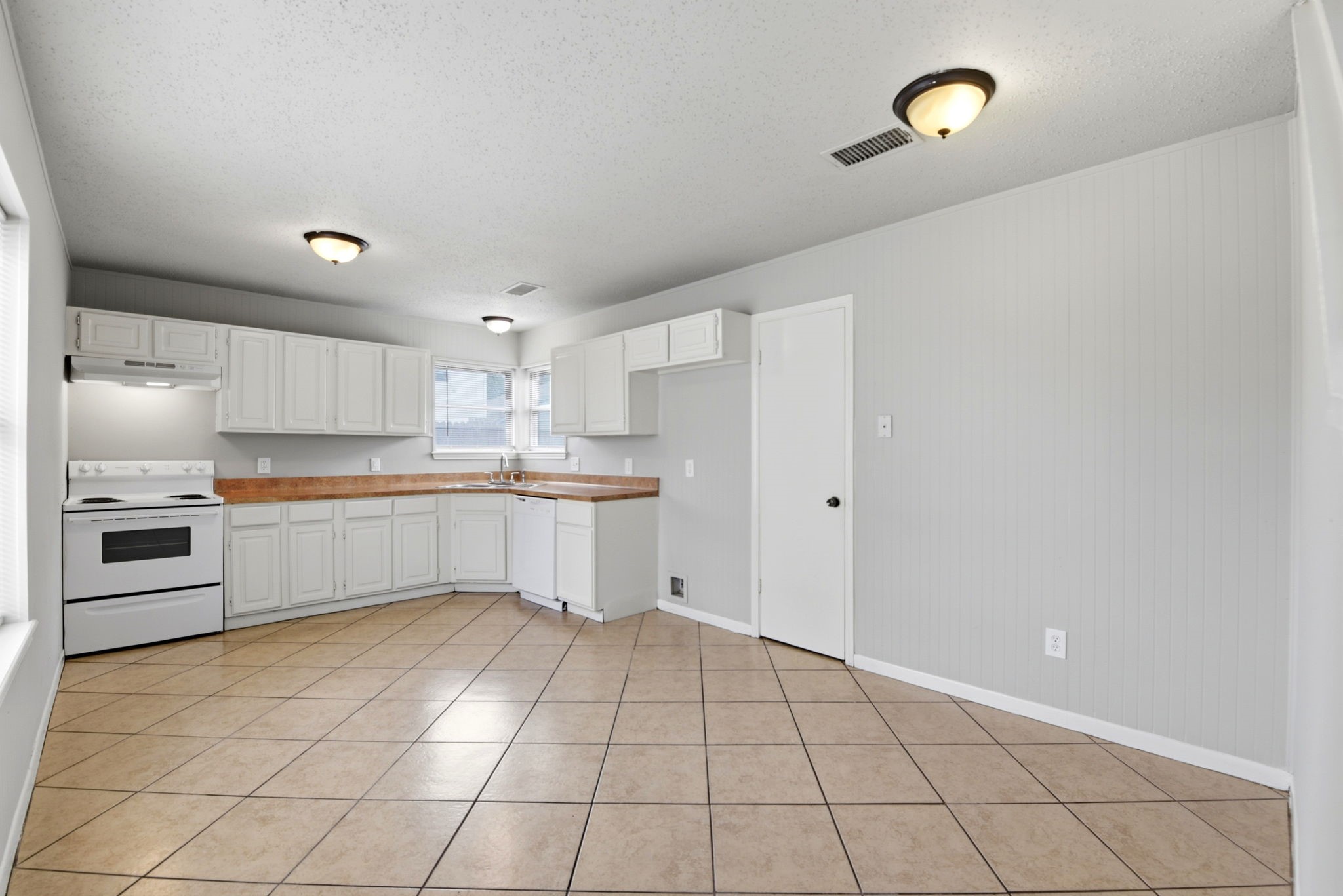 22910 Sherioaks Lane Spring, TX 77389 - Photo 7 of 27 a kitchen with stainless steel appliances a sink and cabinets