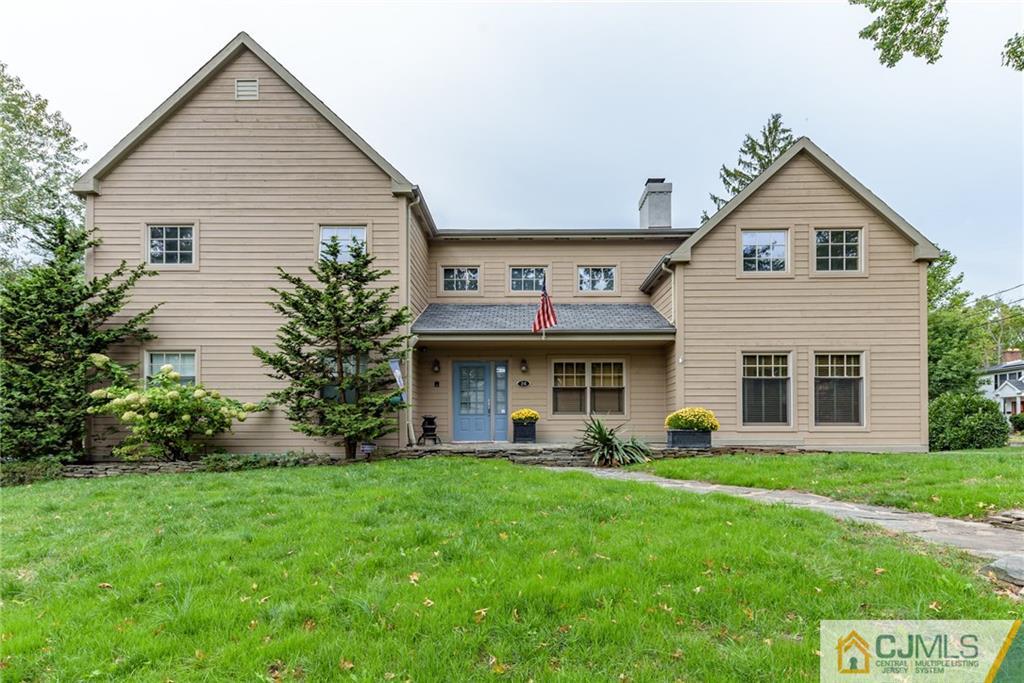 24 East Cliff Road Colonia, NJ 07067 - Photo 1 of 46 a view of a house with a yard and plants
