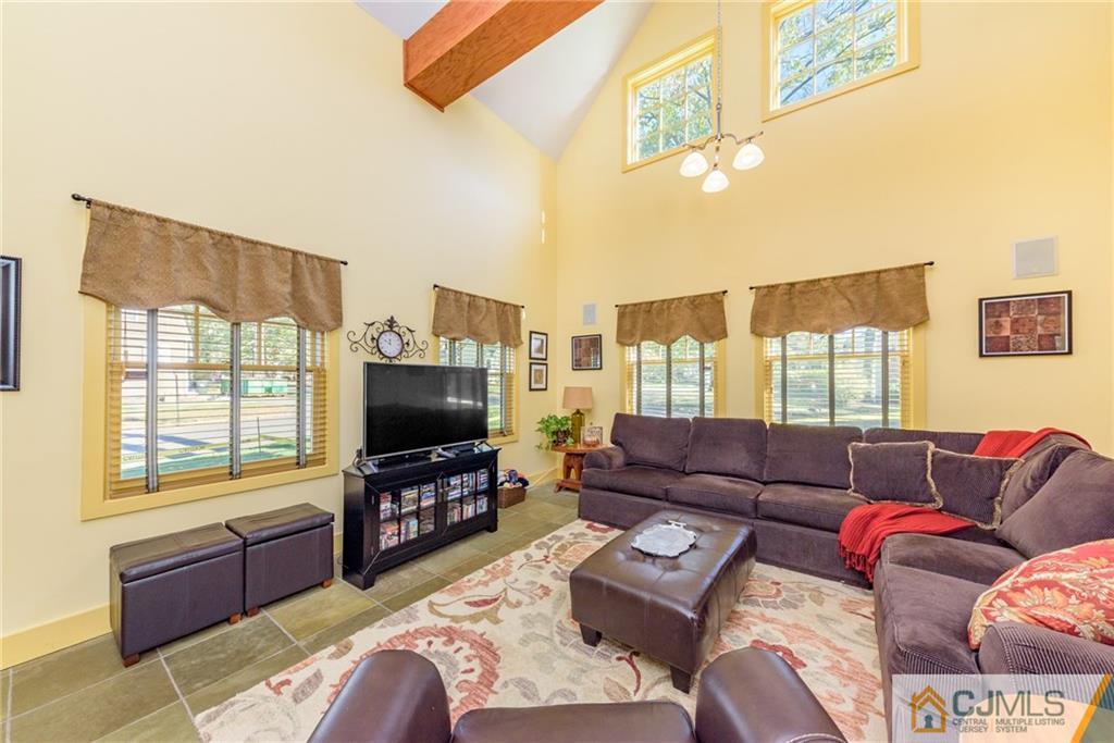 24 East Cliff Road Colonia, NJ 07067 - Photo 13 of 46 a living room with furniture and a flat screen tv