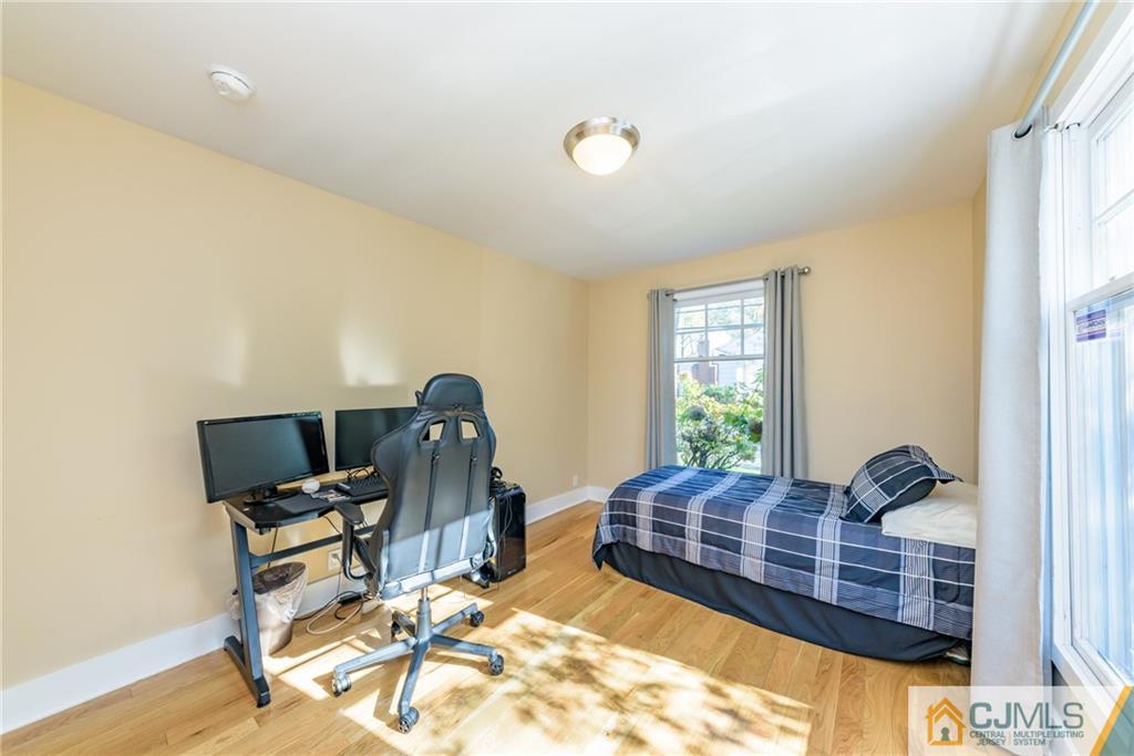 24 East Cliff Road Colonia, NJ 07067 - Photo 19 of 46 a bed room with a bed and window