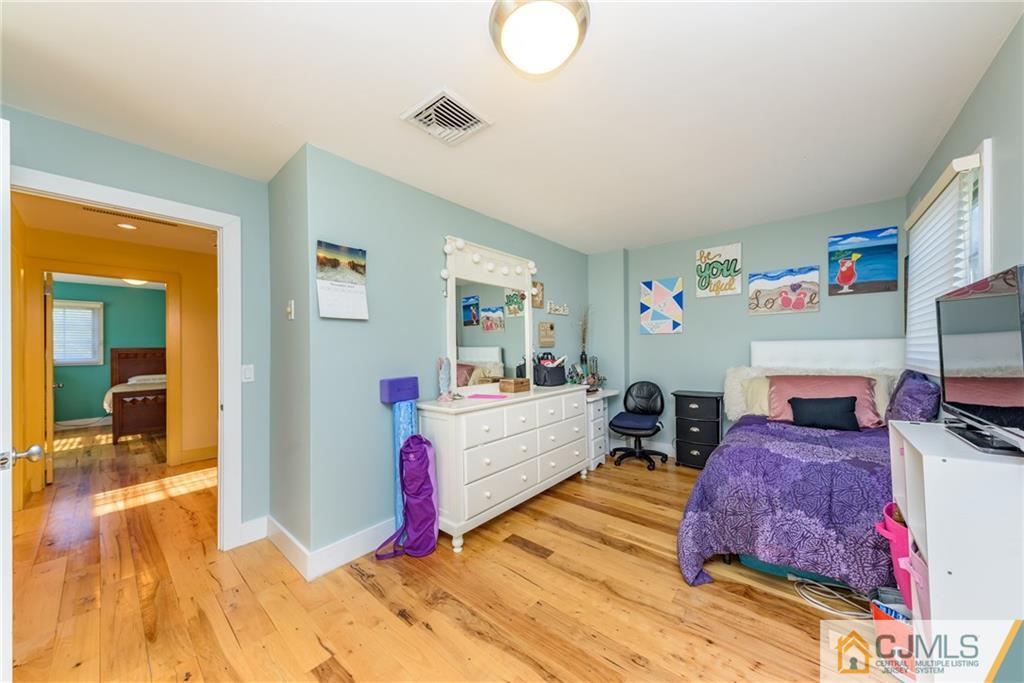 24 East Cliff Road Colonia, NJ 07067 - Photo 26 of 46 a room with furniture and a flat screen tv