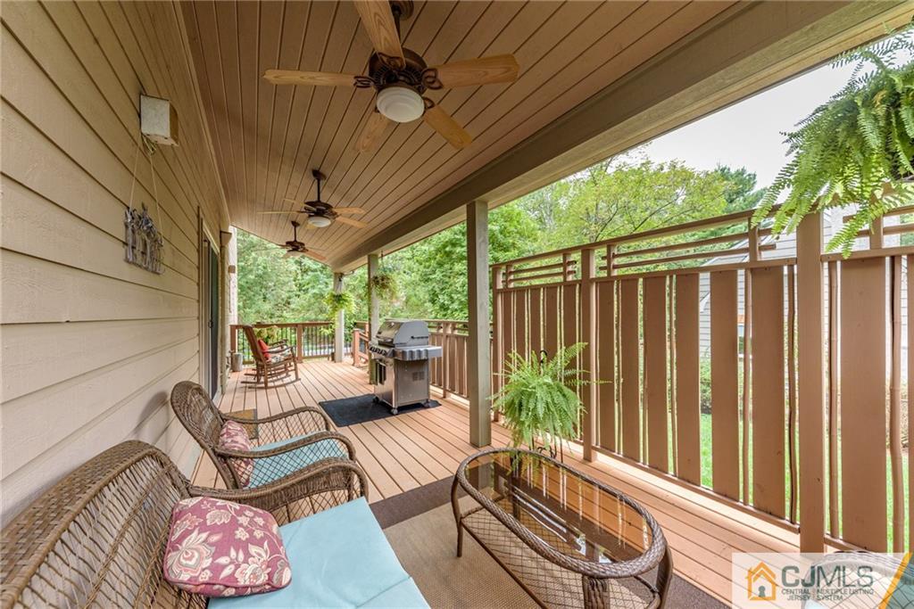 24 East Cliff Road Colonia, NJ 07067 - Photo 38 of 46 a balcony with furniture and a potted plant